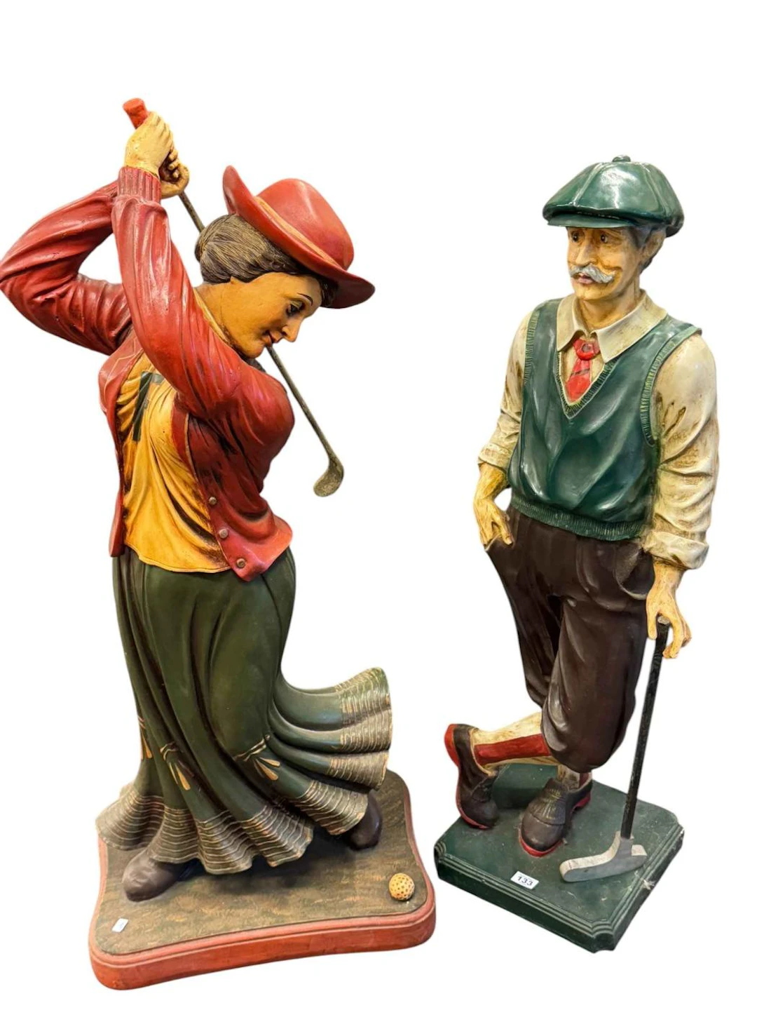 Two large novelty golfing figures.