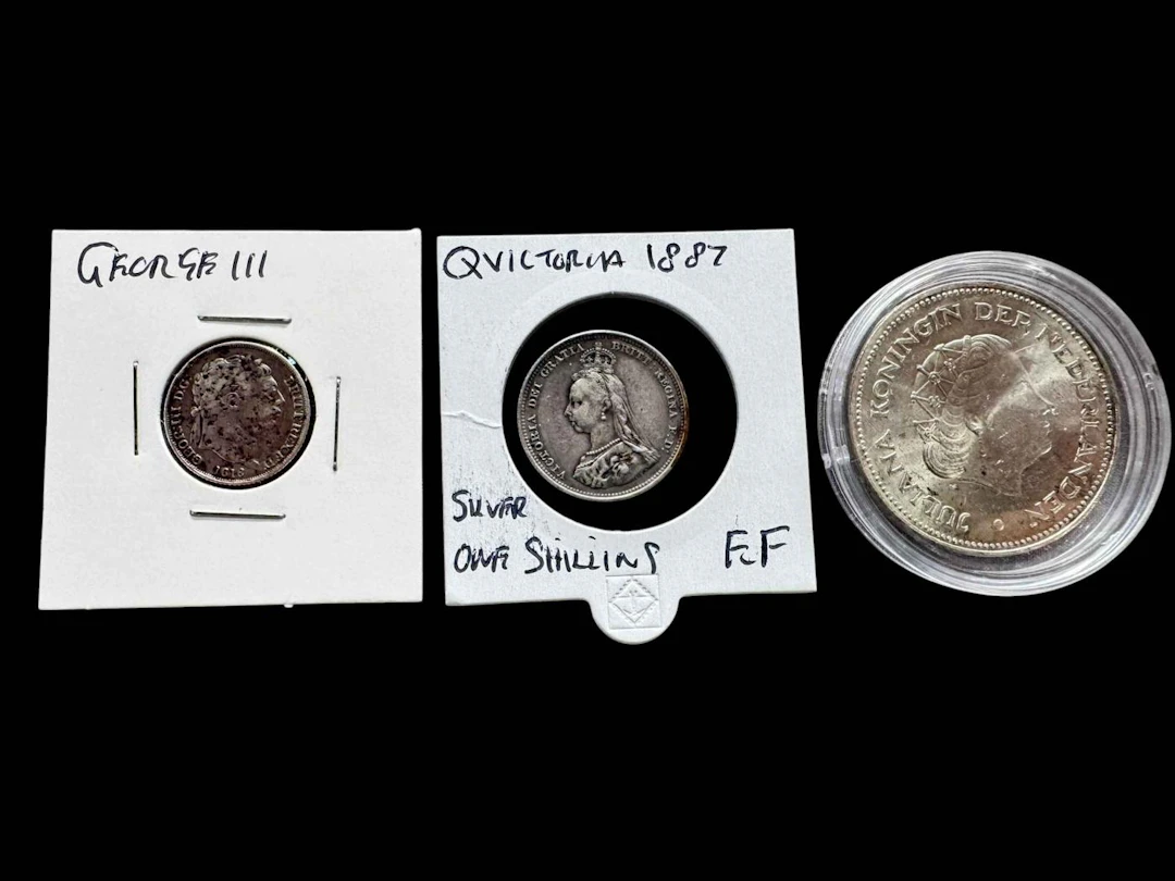 Dutch silver 10 gulden, 1818 sixpence and 1887 shilling (3).