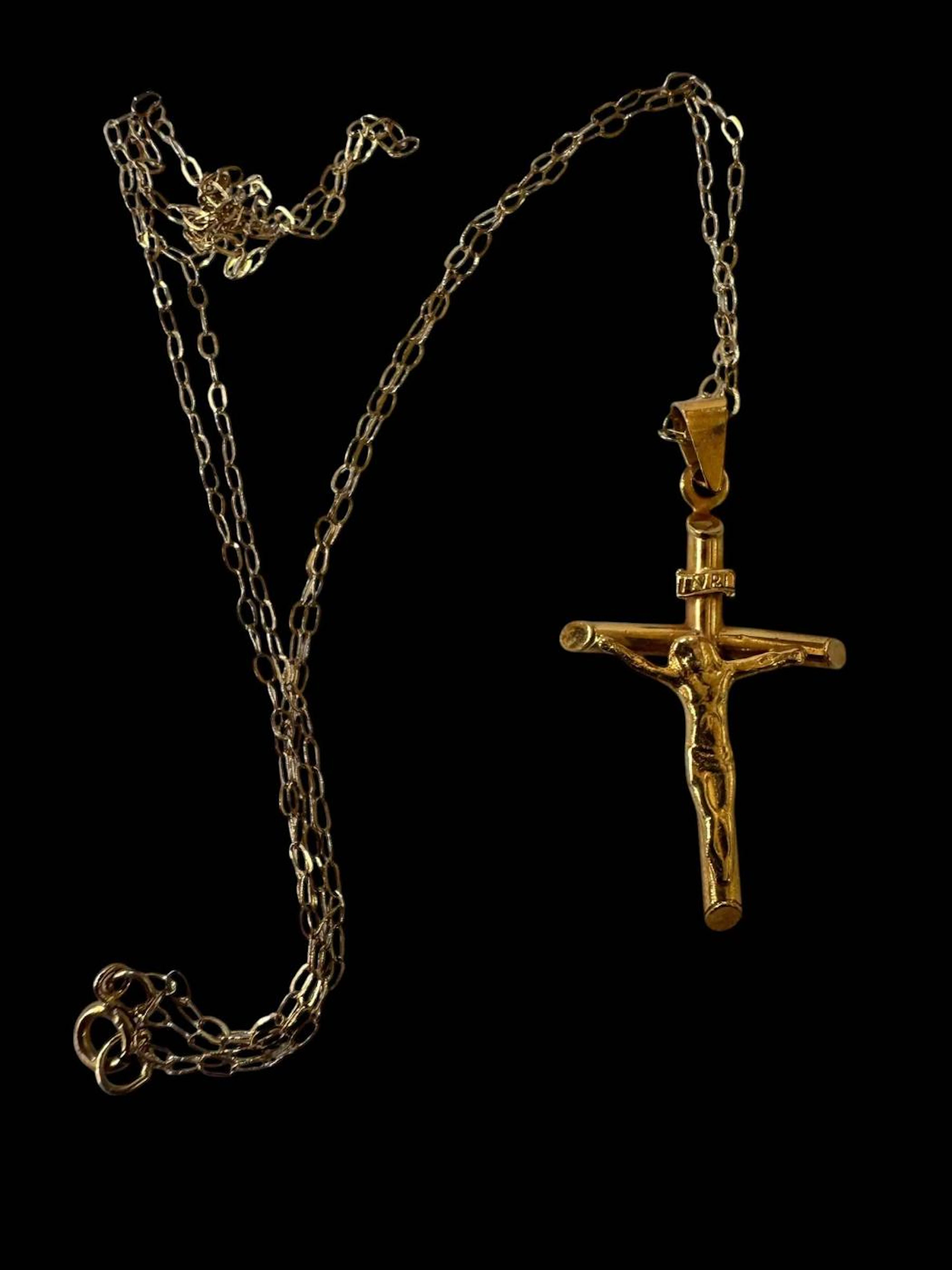 Two 9 carat gold signet rings, and 9 carat gold crucifix with chain (3).