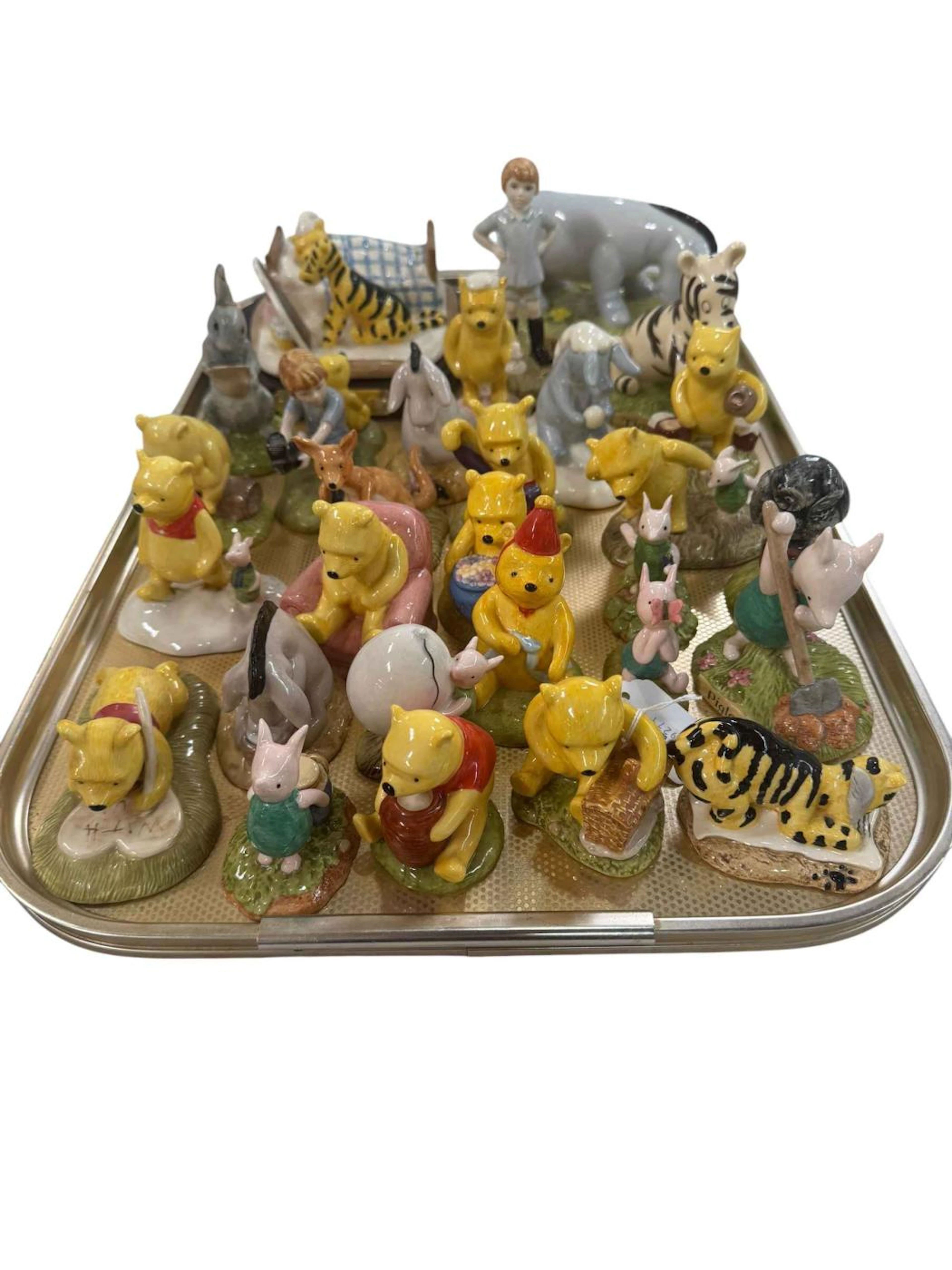 Royal Doulton Winnie the Pooh figures, 28 pieces.