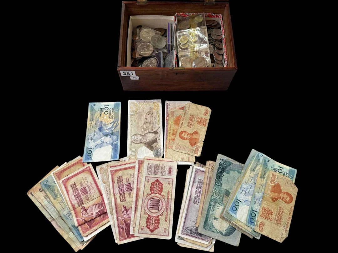 Box with coins and banknotes.