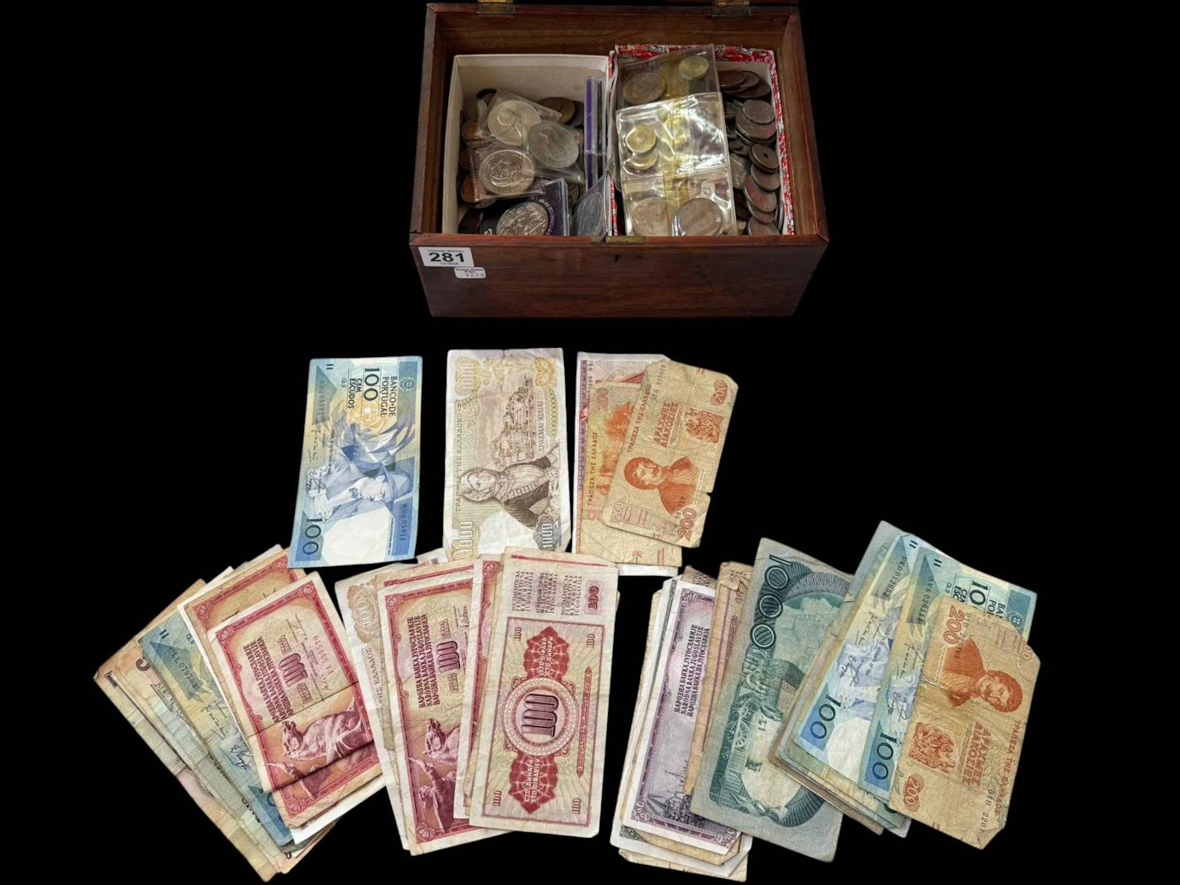 Box with coins and banknotes.