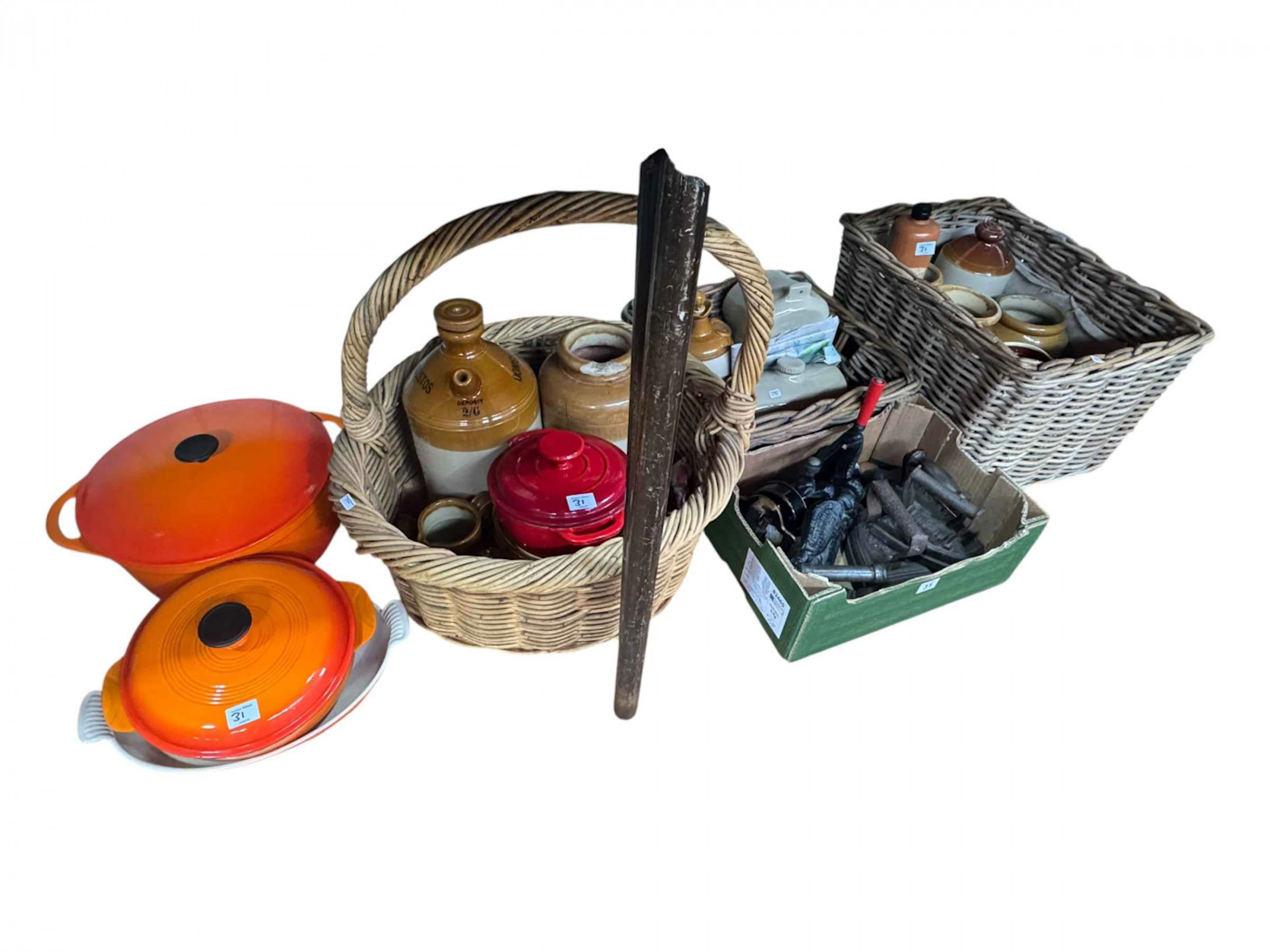 Collection of stoneware bottles and jars, three wicket baskets, flat