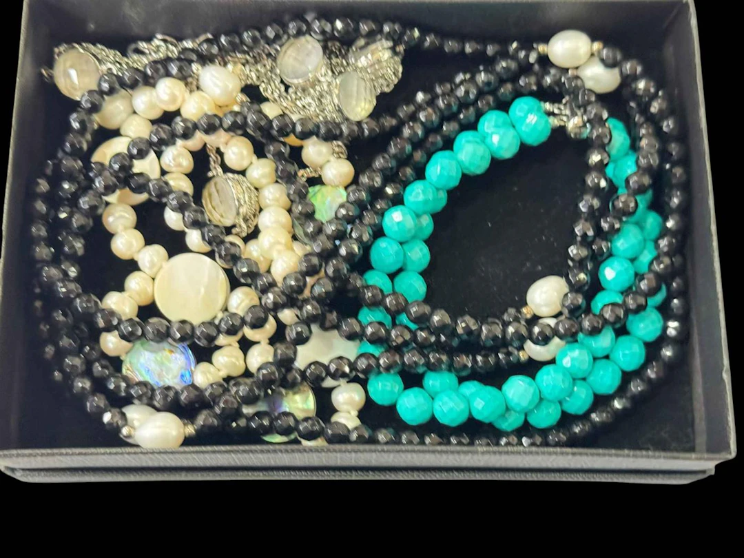 Box with silver spinel rings, turquoise bracelet, necklaces, etc.