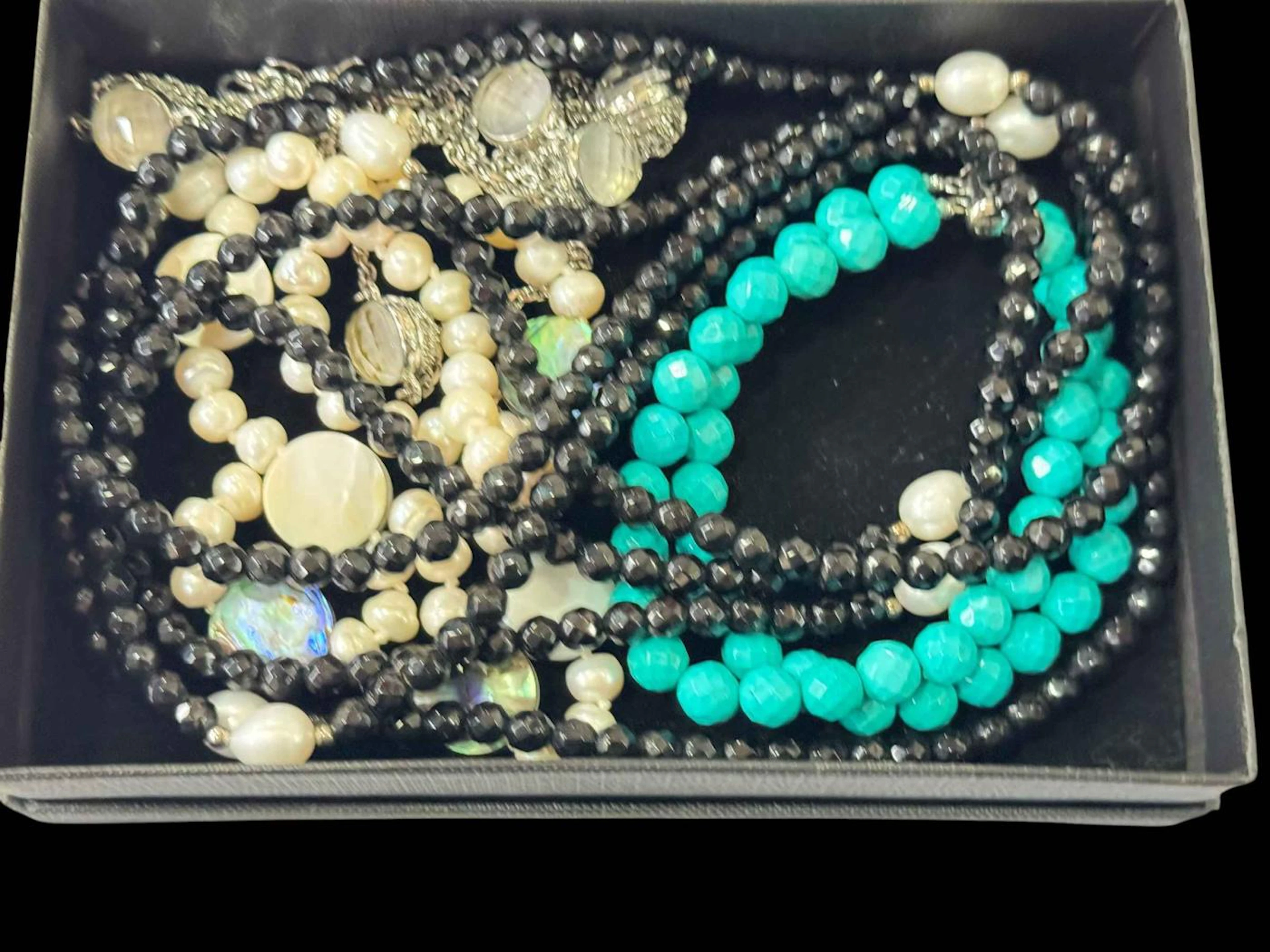 Box with silver spinel rings, turquoise bracelet, necklaces, etc.