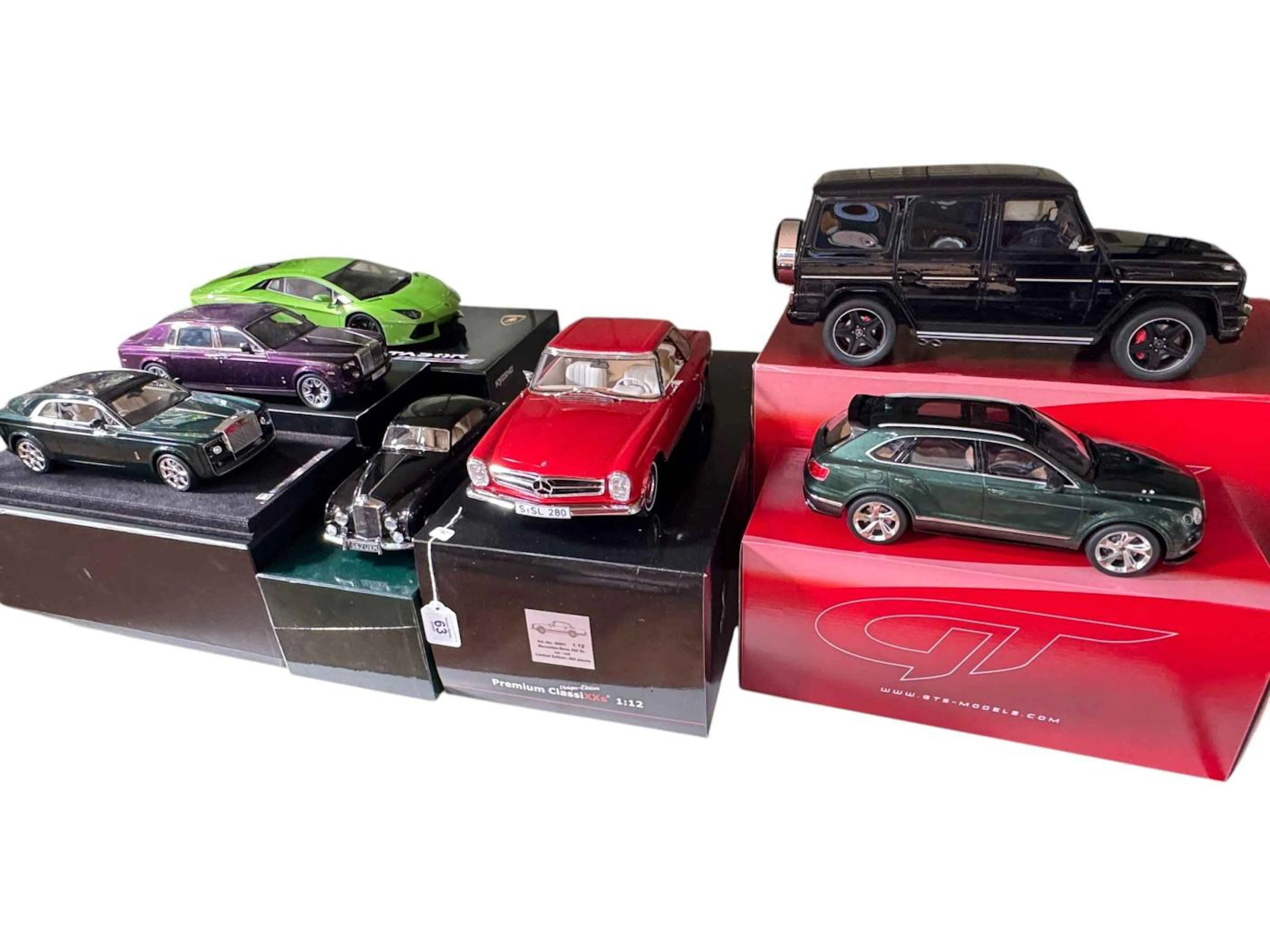 Seven boxed model vehicles including two GTS Models Mercedes AMG G65