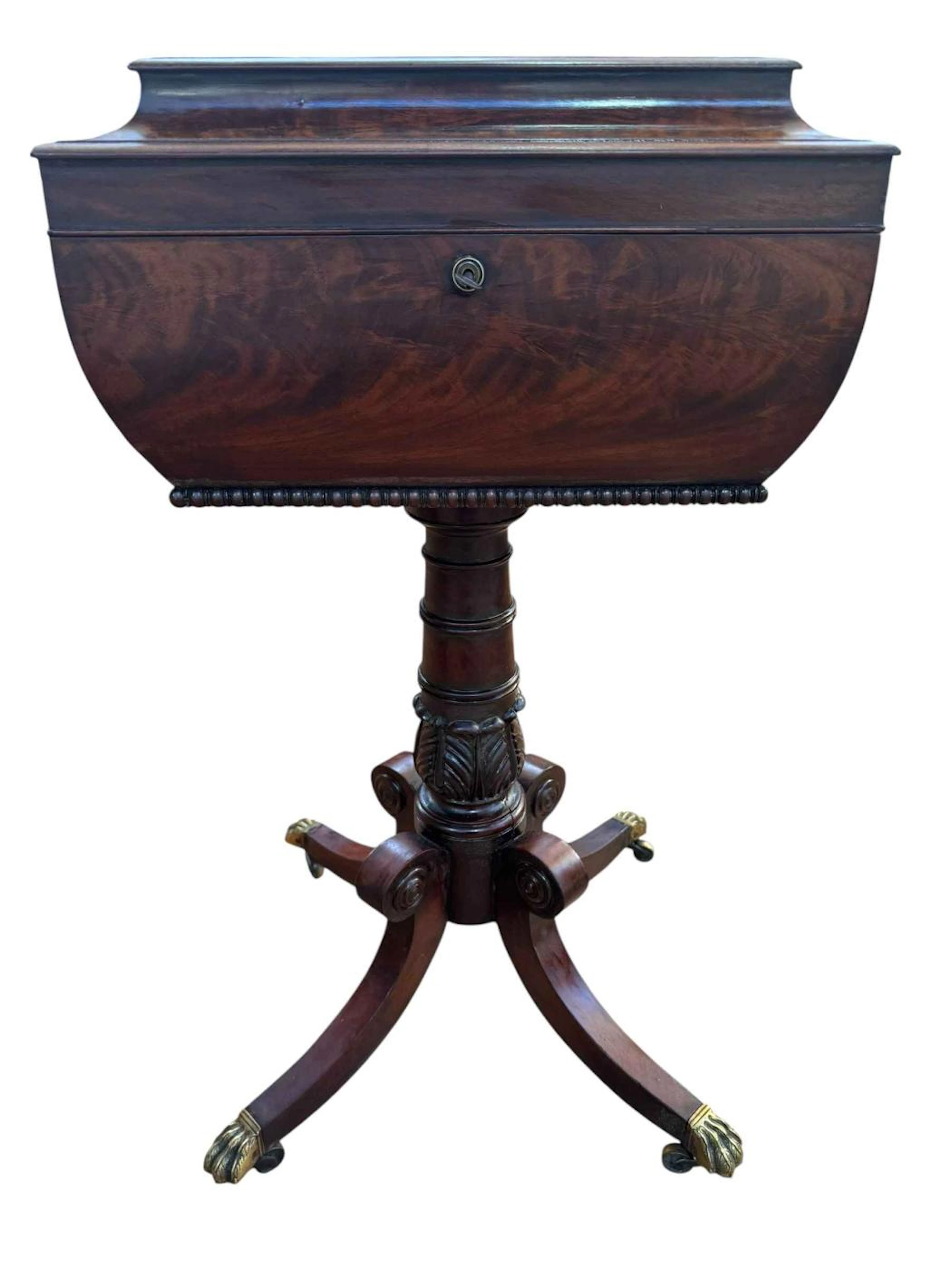 Victorian mahogany pedestal teapoy featuring sarcophagus-form hinged