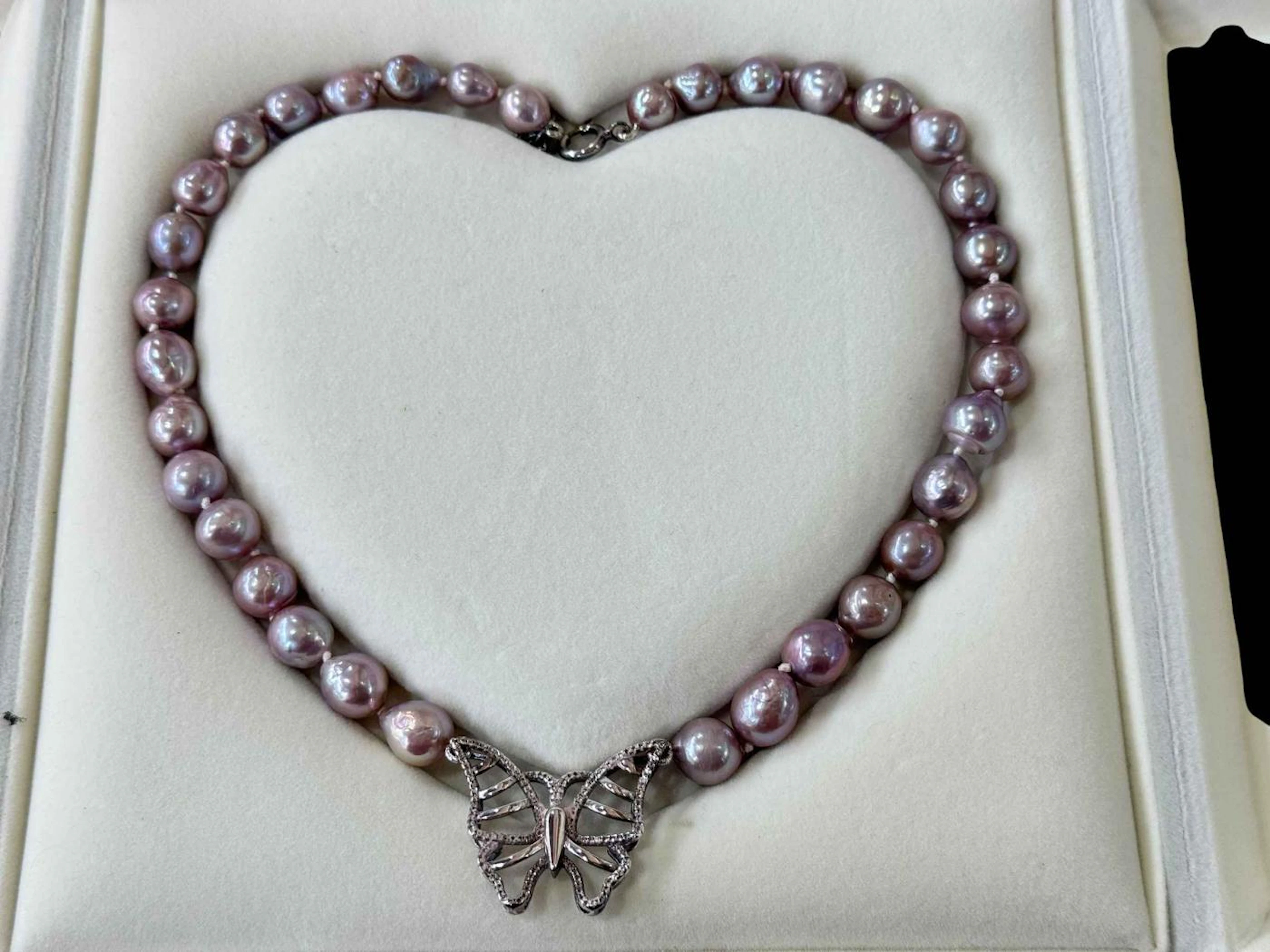 Lilac South Sea pearl necklace with silver butterfly clasp.