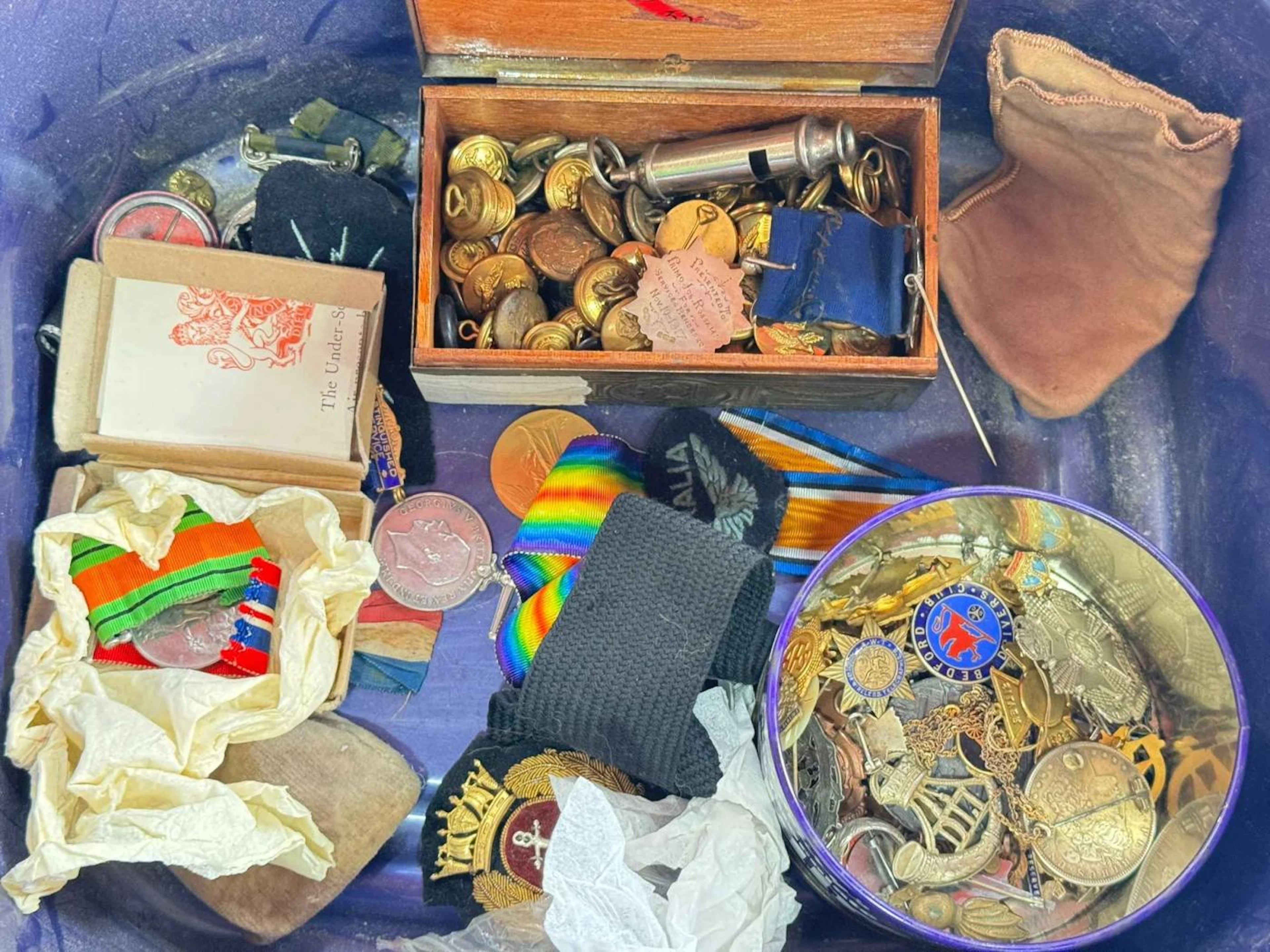 Collection of medals and badges and two files of ship images and military