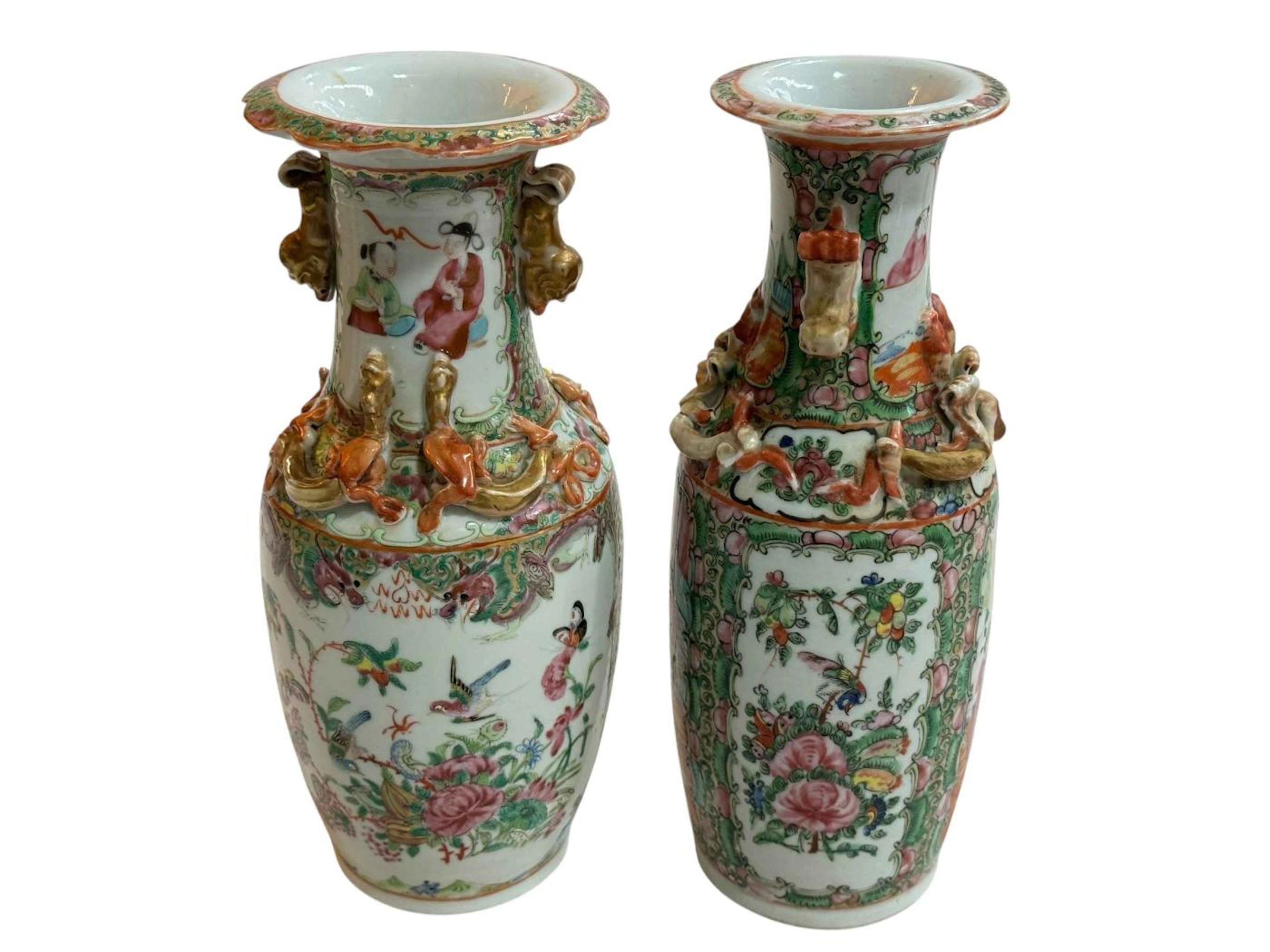 Two Cantonese vases with famille rose, bird and figure decoration, 25.5cm.