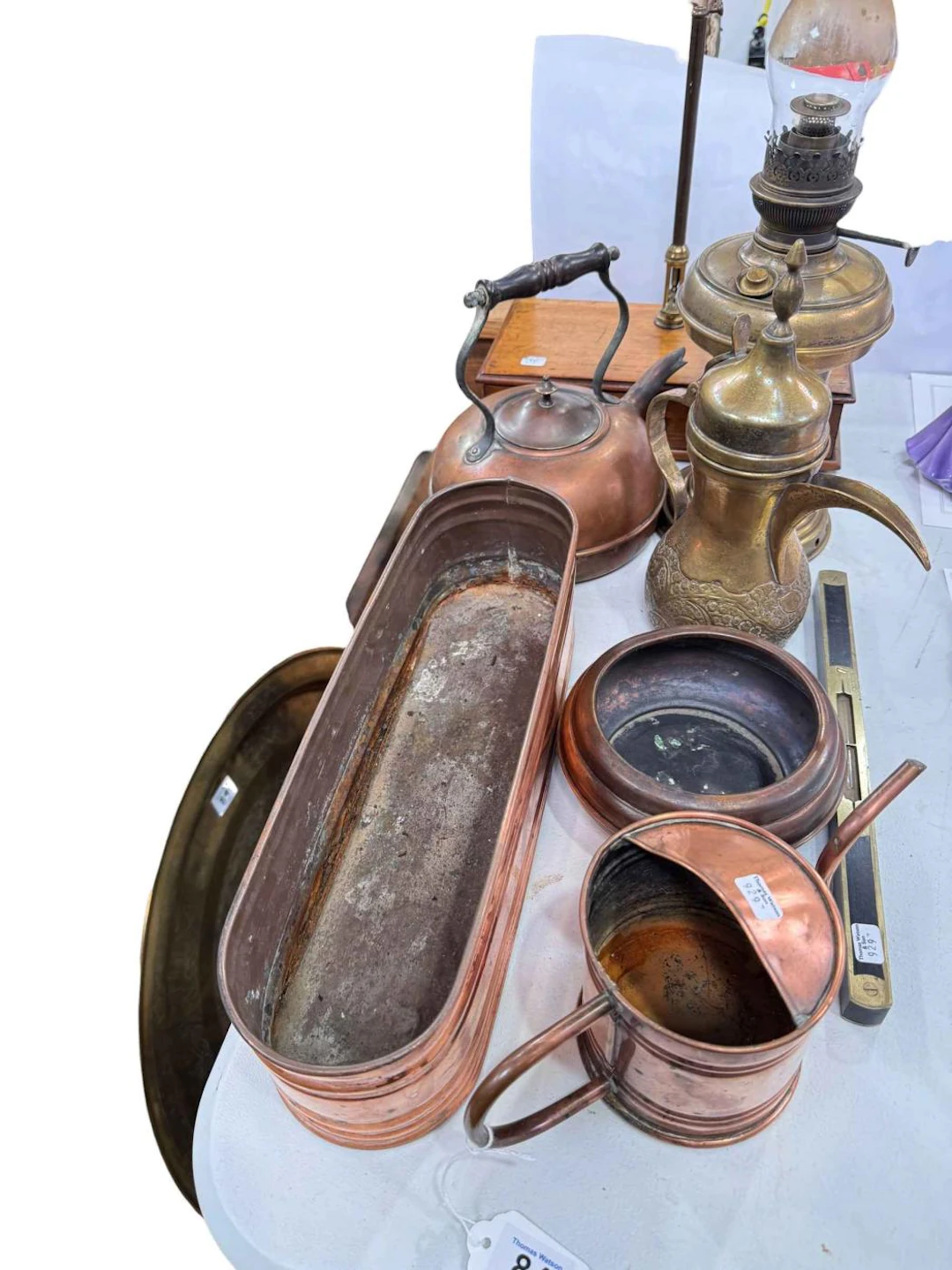 Folding brass topped table, set of balance scales, copper and brass.