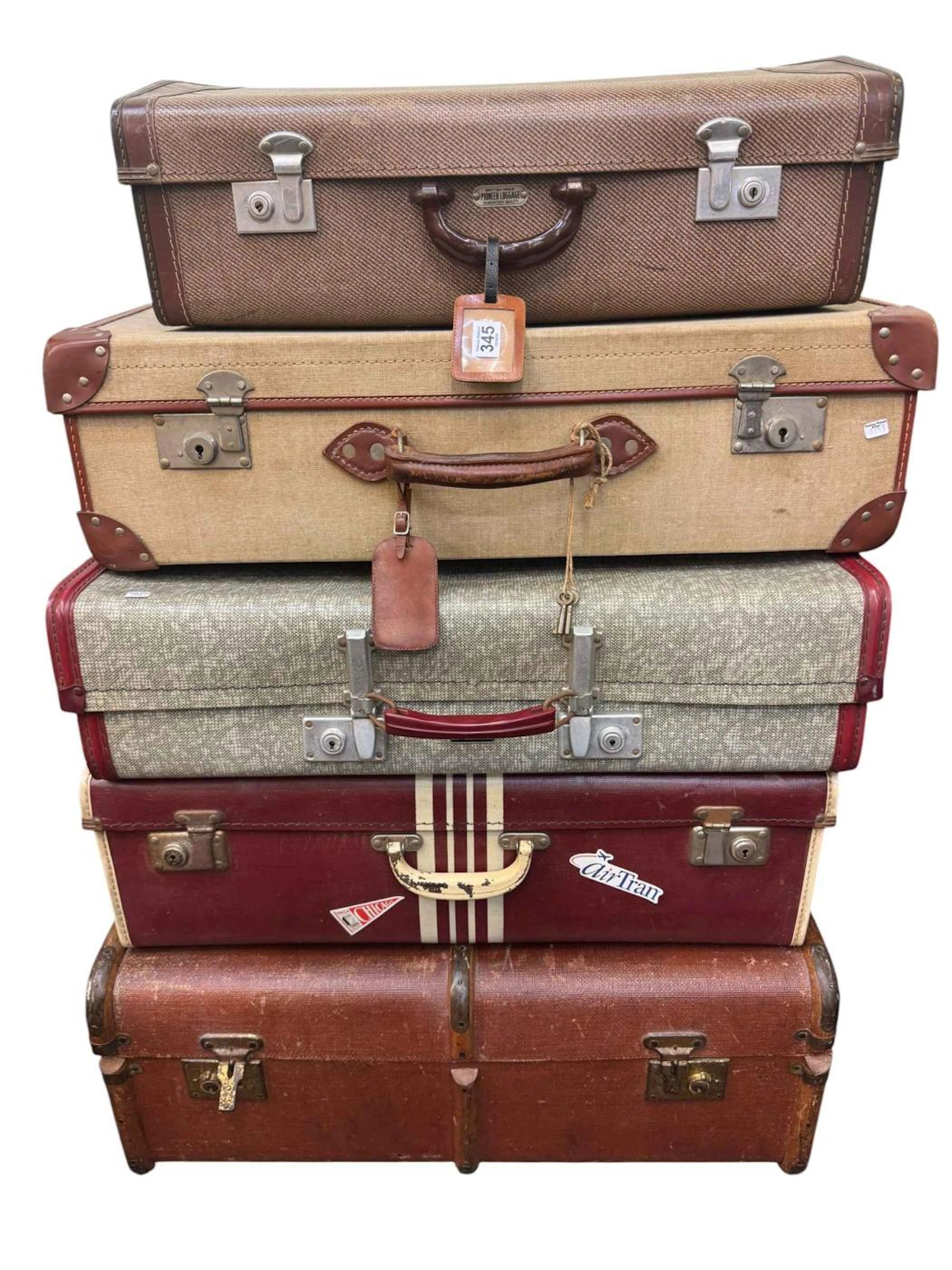 Five vintage suitcases.
