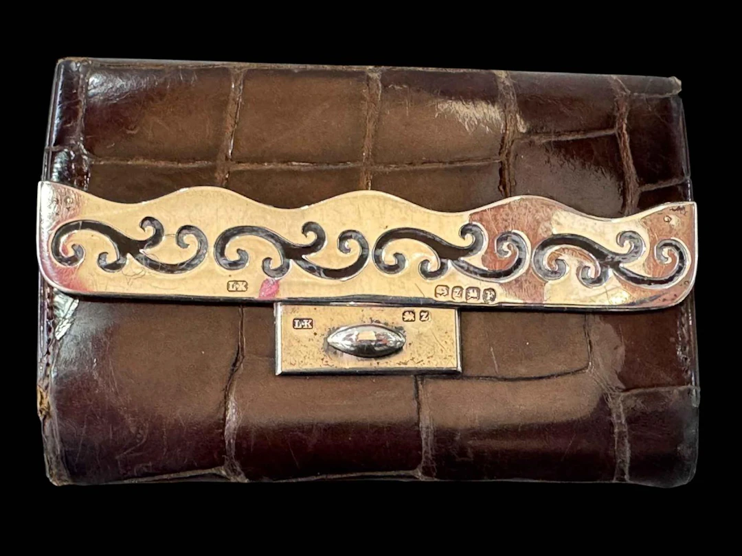 Silver mounted crocodile skin purse, Birmingham 1899, presented to