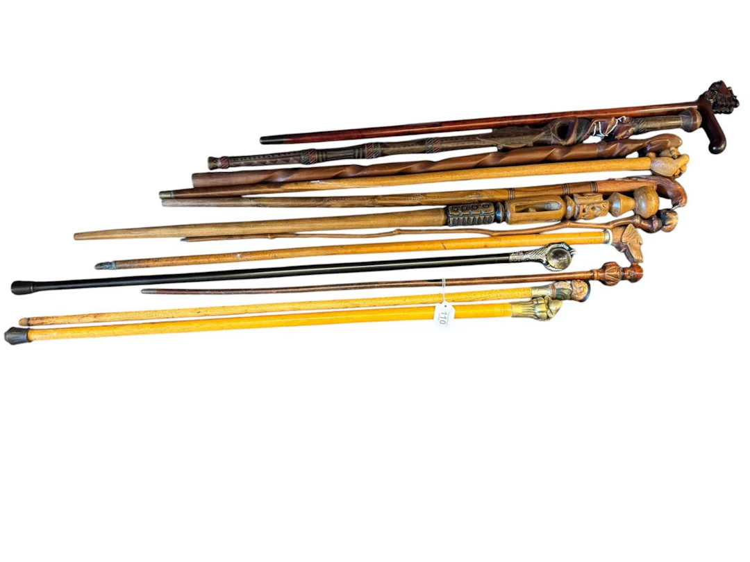 Collection of novelty handled walking sticks including dog glove holder