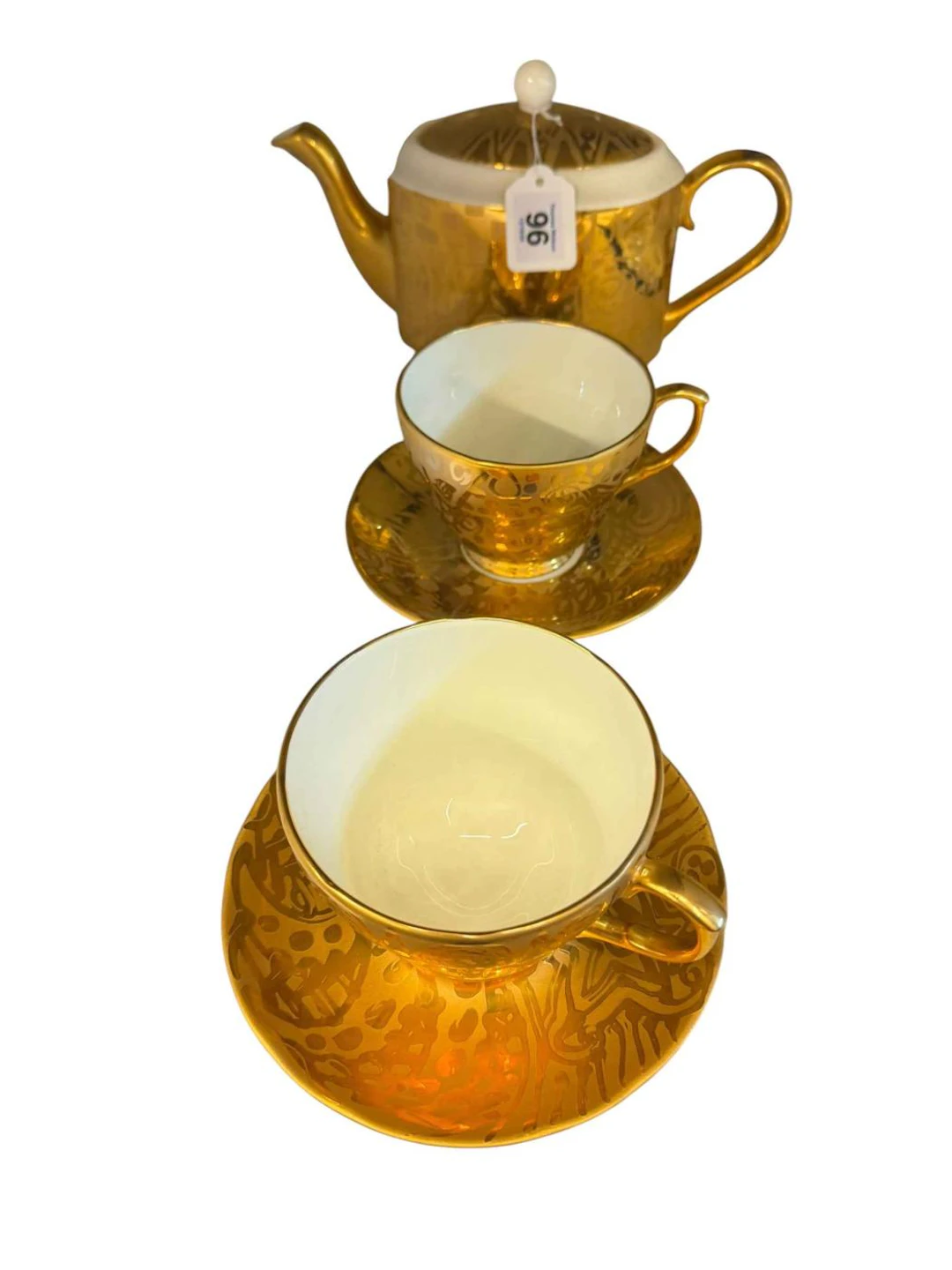 Vintage Rob Turner gilded teapot and two cups and saucers.