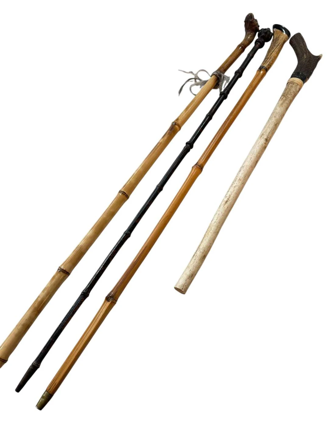 Two horn handled sword sticks and two novelty handled sword sticks (4).