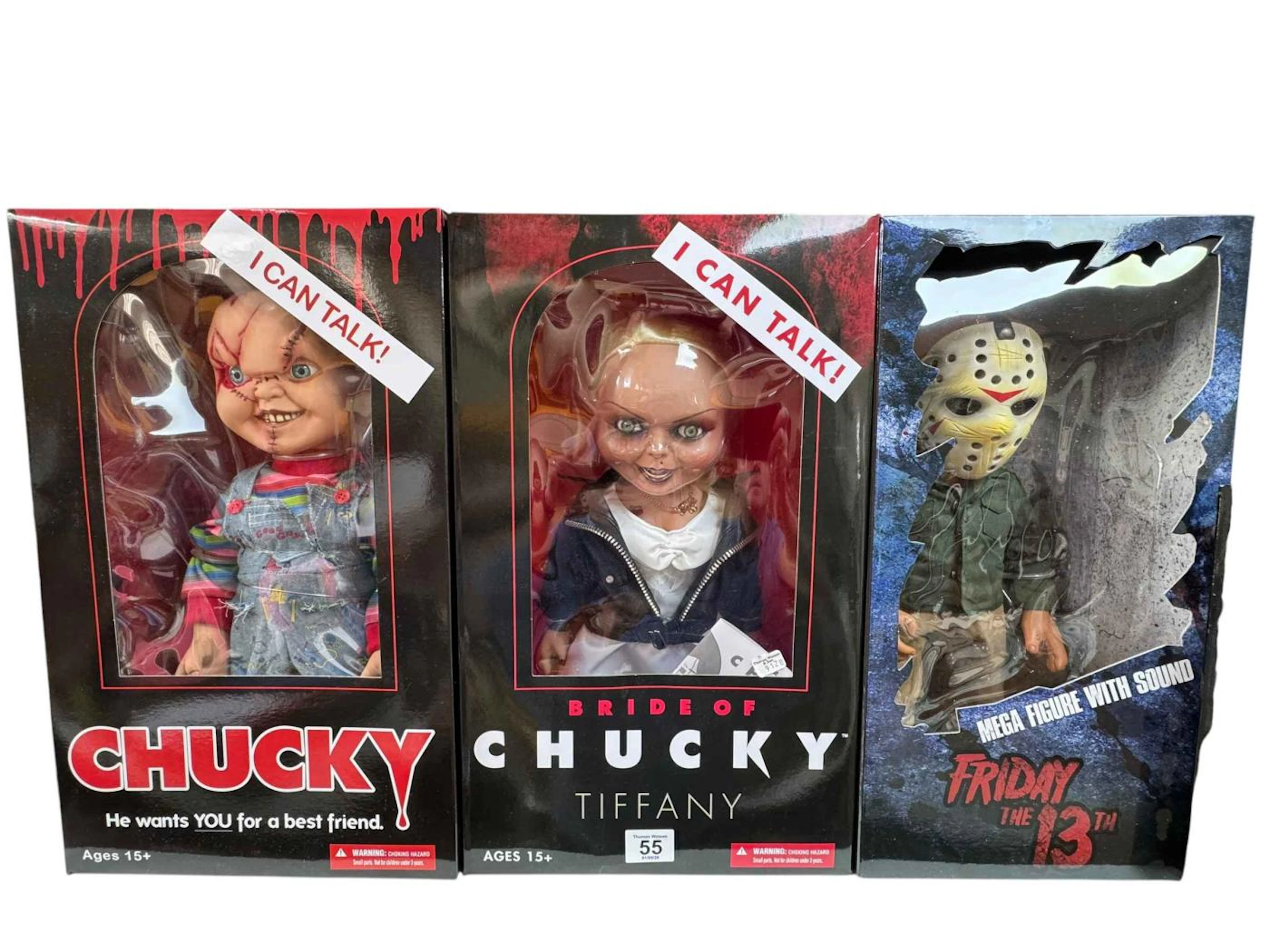Three horror film figures, Chucky, Bride of Chucky Tiffany and Friday