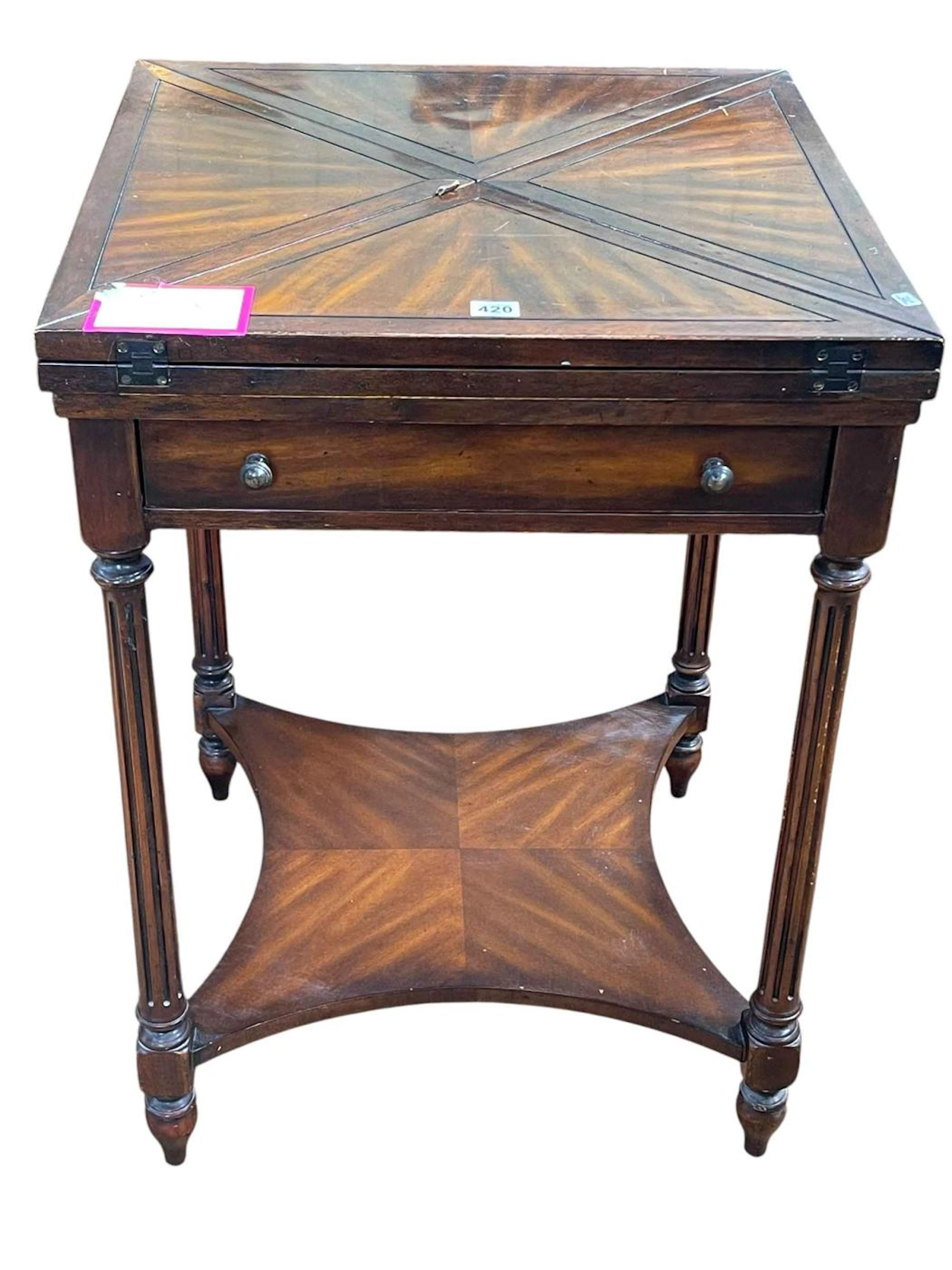 Mahogany envelope card table with frieze drawer raised on reeded legs