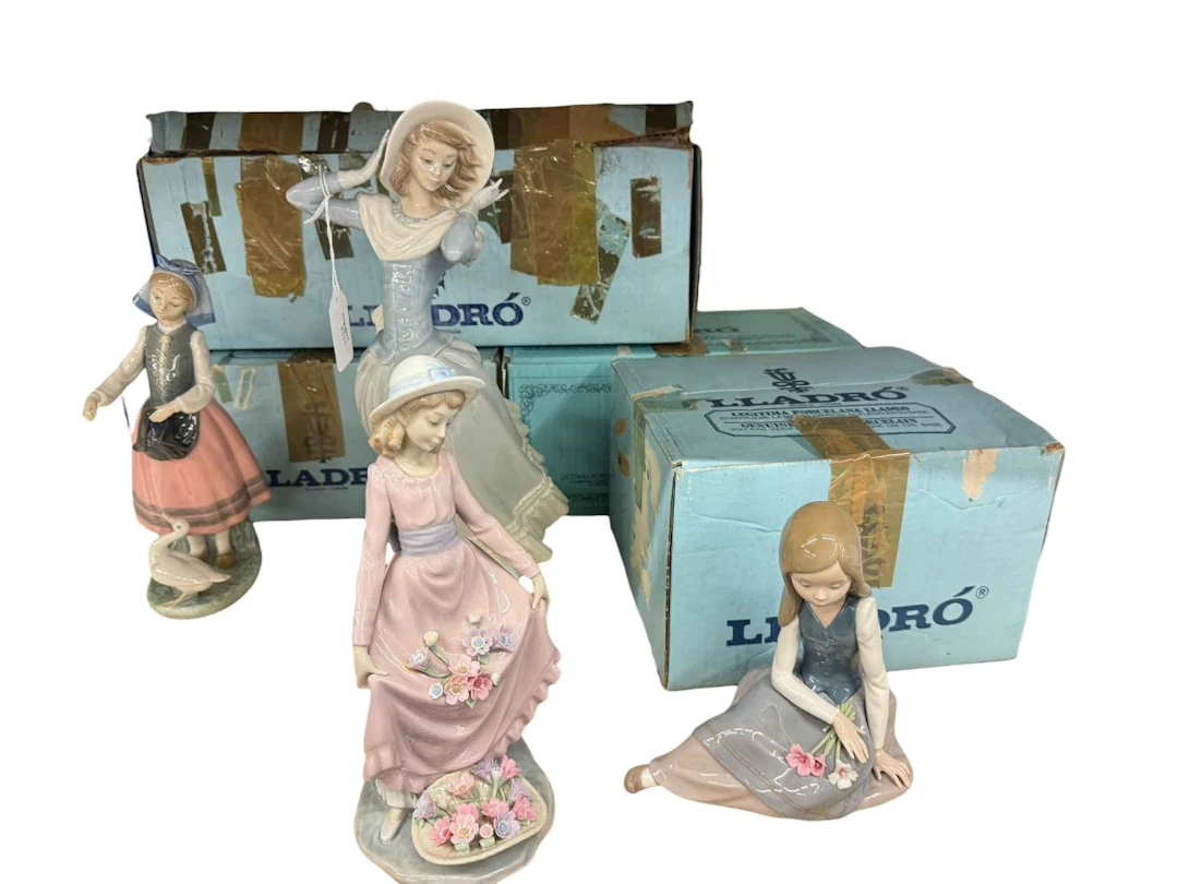 Four Lladro figures; Flower Basket, Spring Breeze, Nostalgia and Josepha