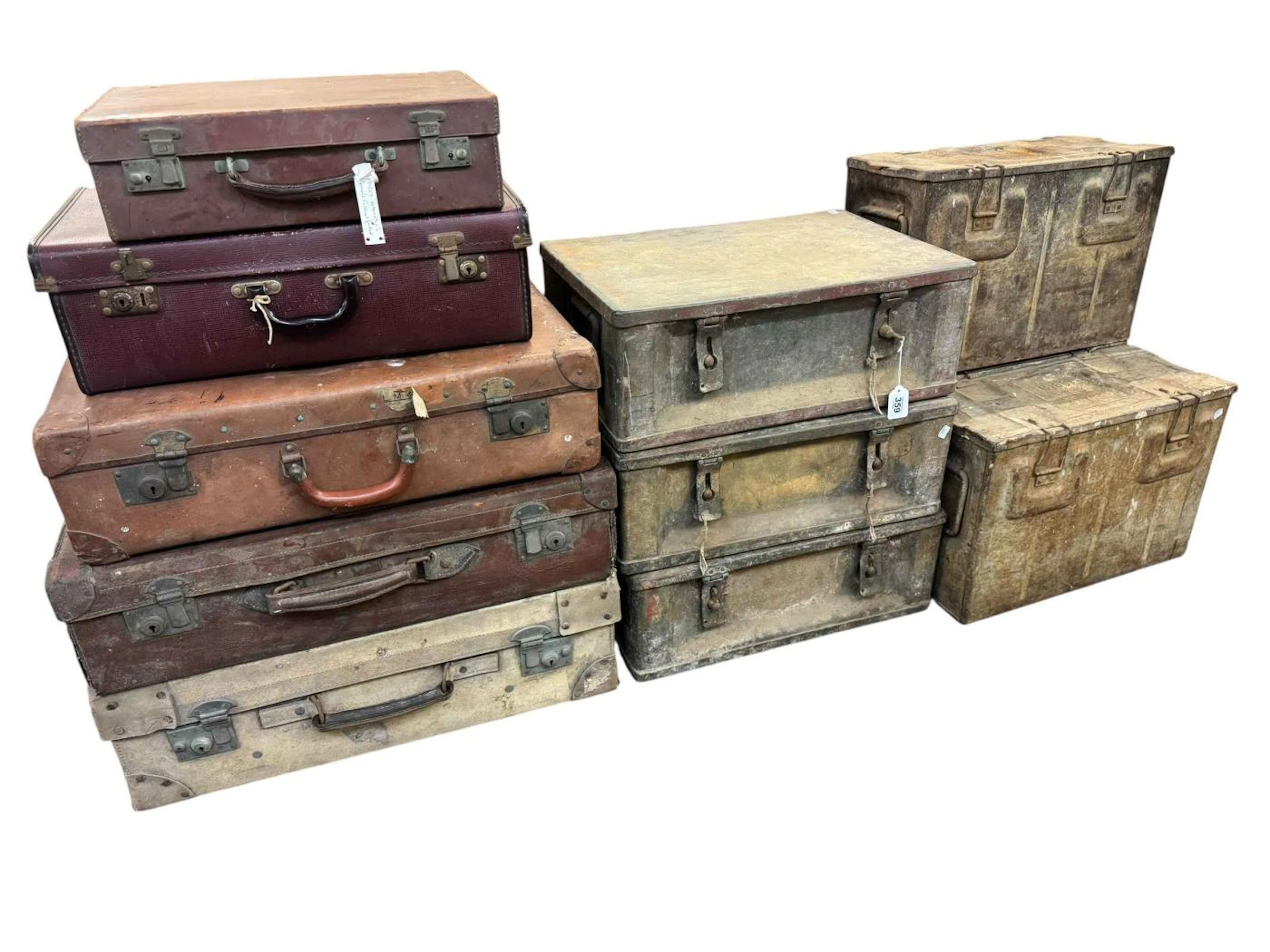 Collection of vintage military metal storage boxes and ammunition