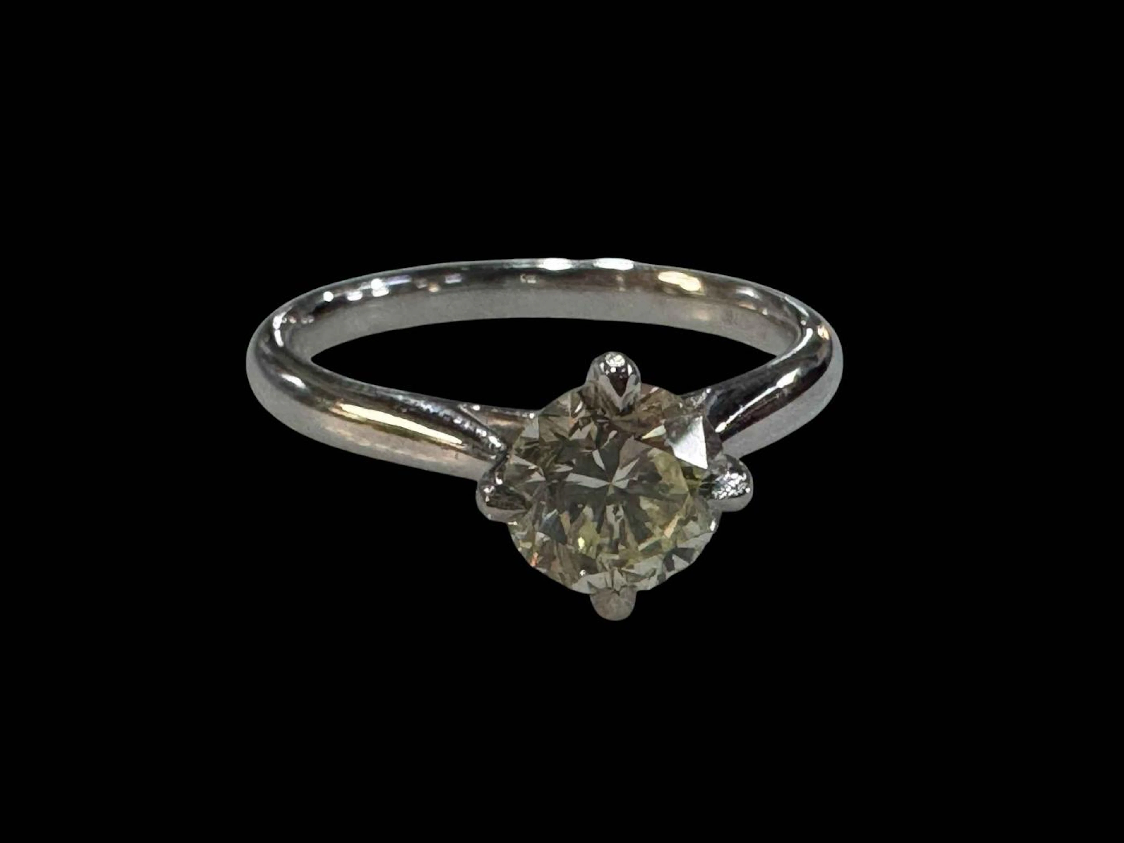Platinum set solitaire diamond ring, diamond over 1 carat, size M.