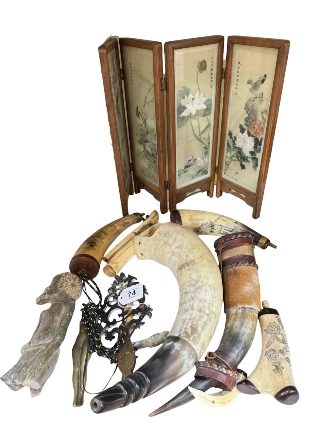 Oriental four fold table screen, horn powder flasks, brass trivet