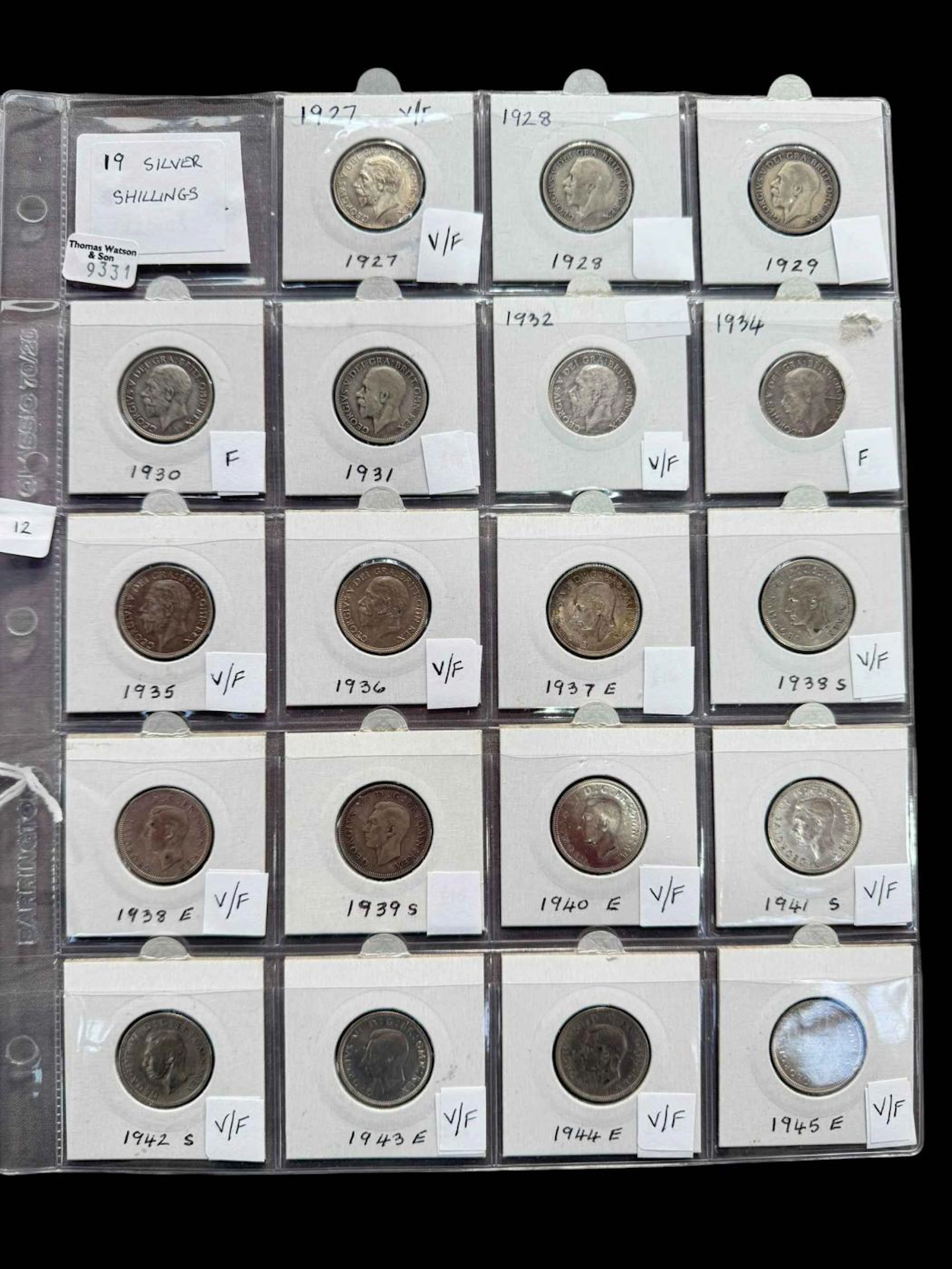 Nineteen silver shillings.