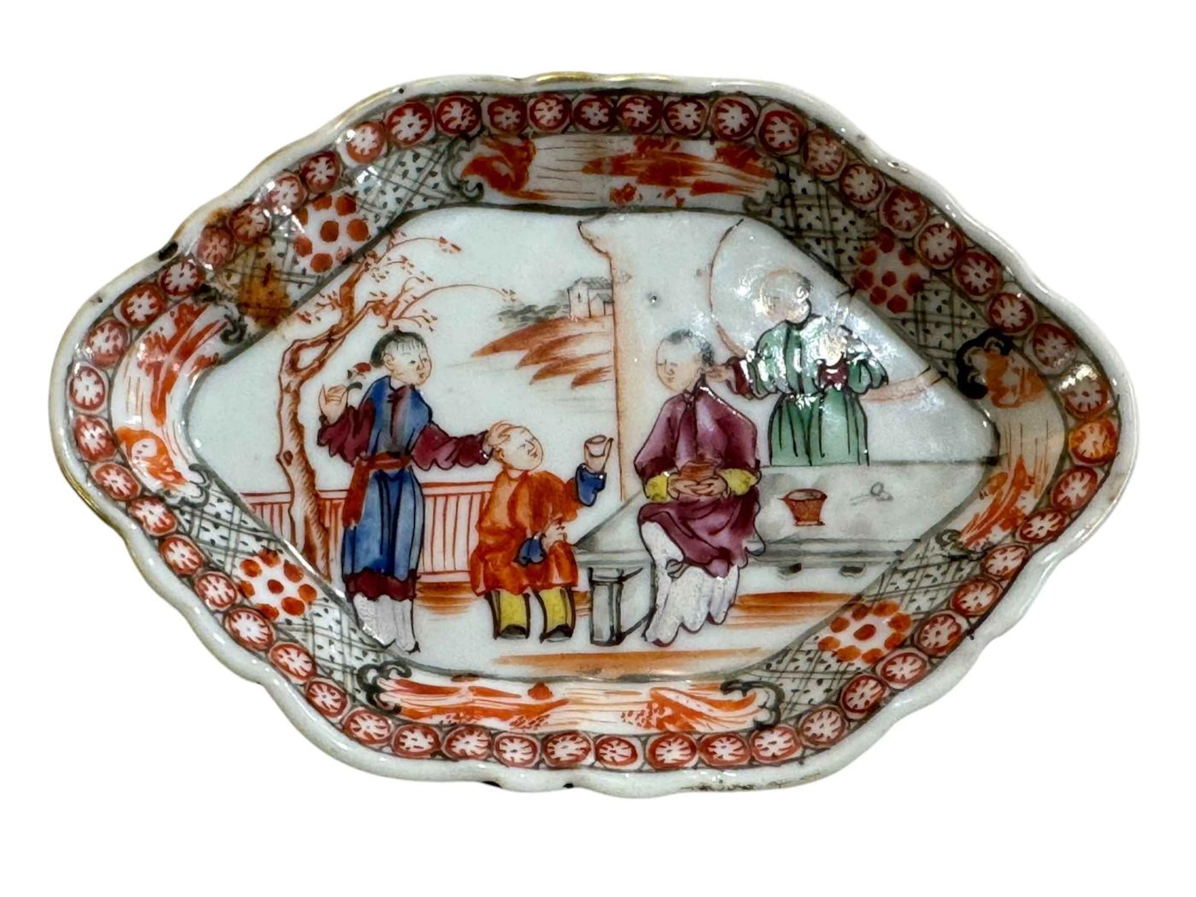 Small Chinese pin dish decorated with figures, 13cm by 9cm.