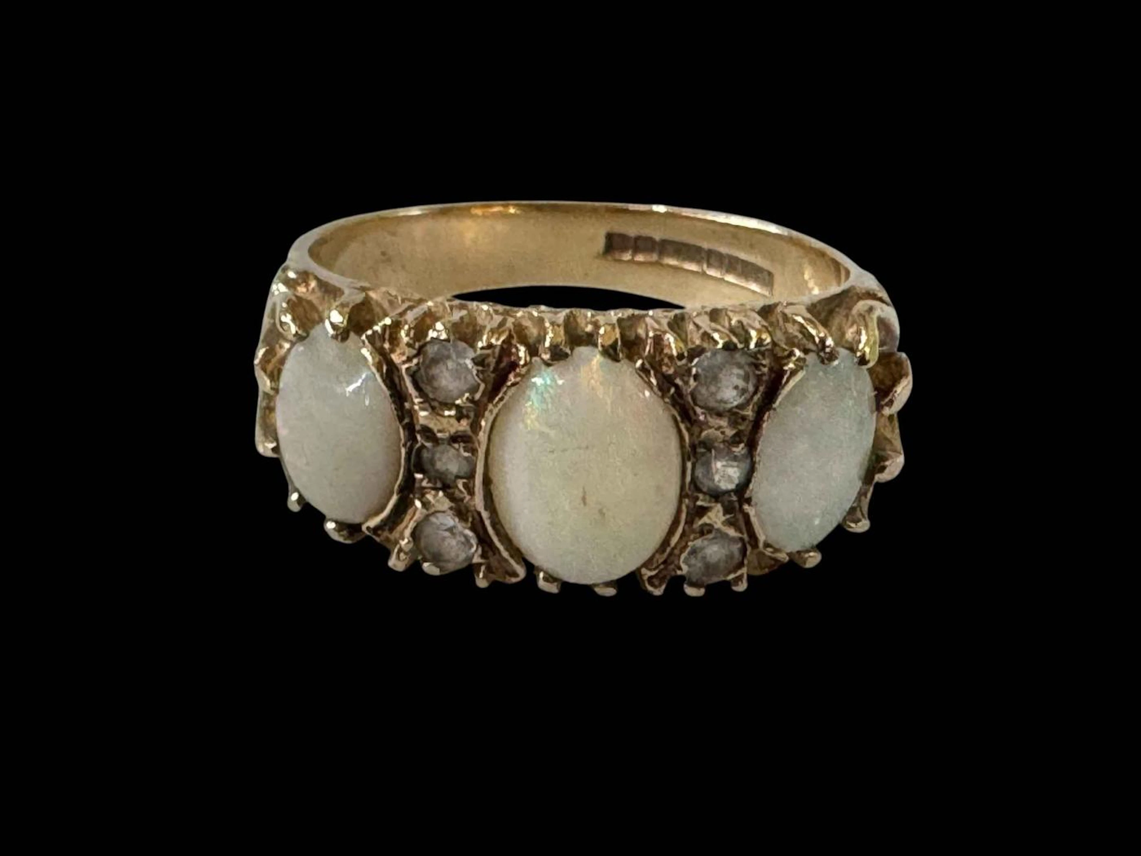 Opal three stone and diamond 9 carat gold ring, size Q.