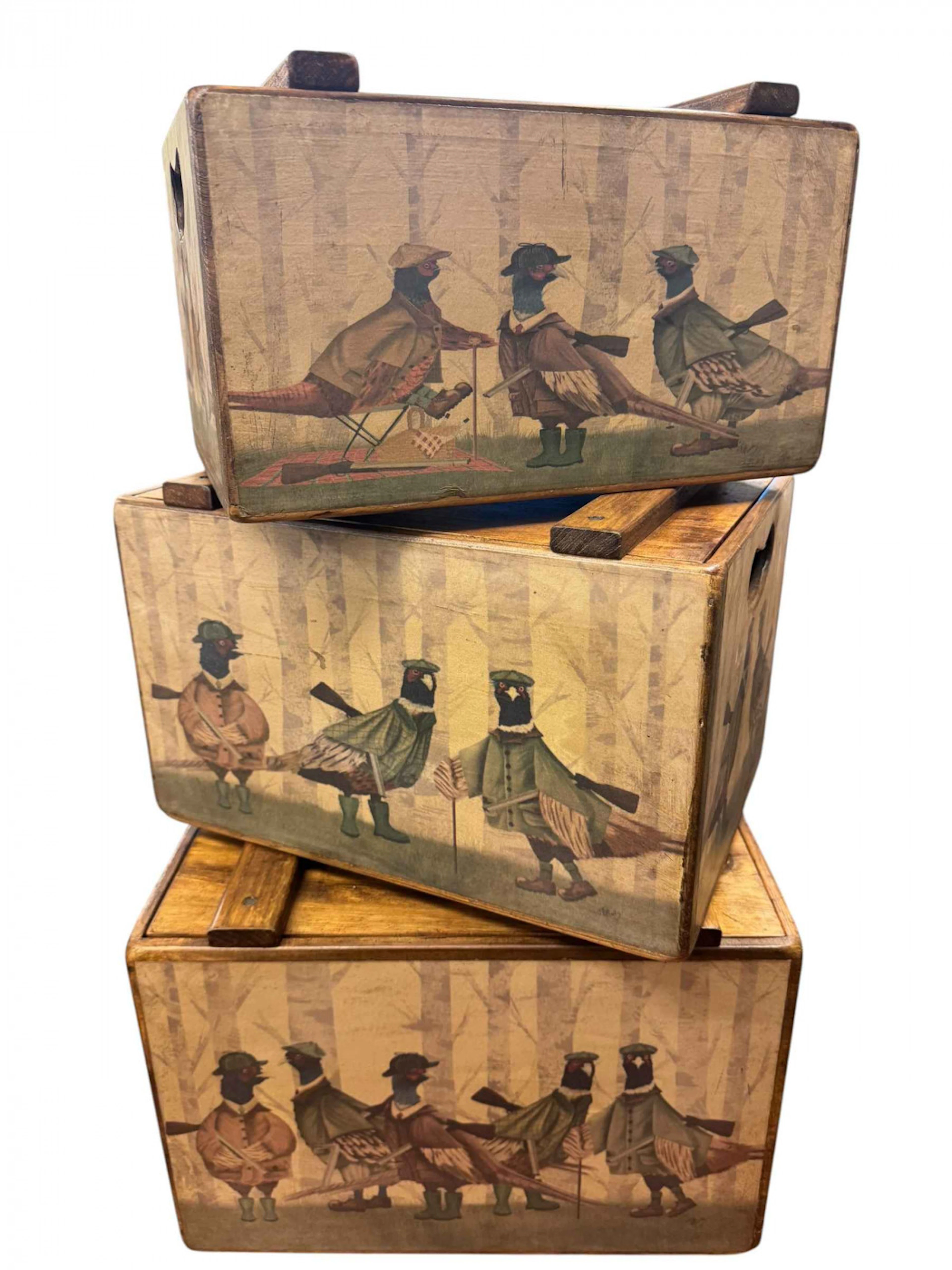 Three graduated wood boxes with comical game bird decoration.