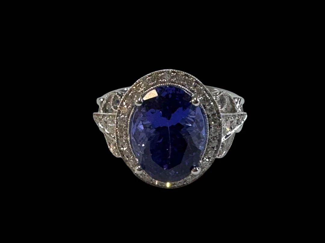 18 carat white gold diamond and tanzanite ring, set with oval tanzanite