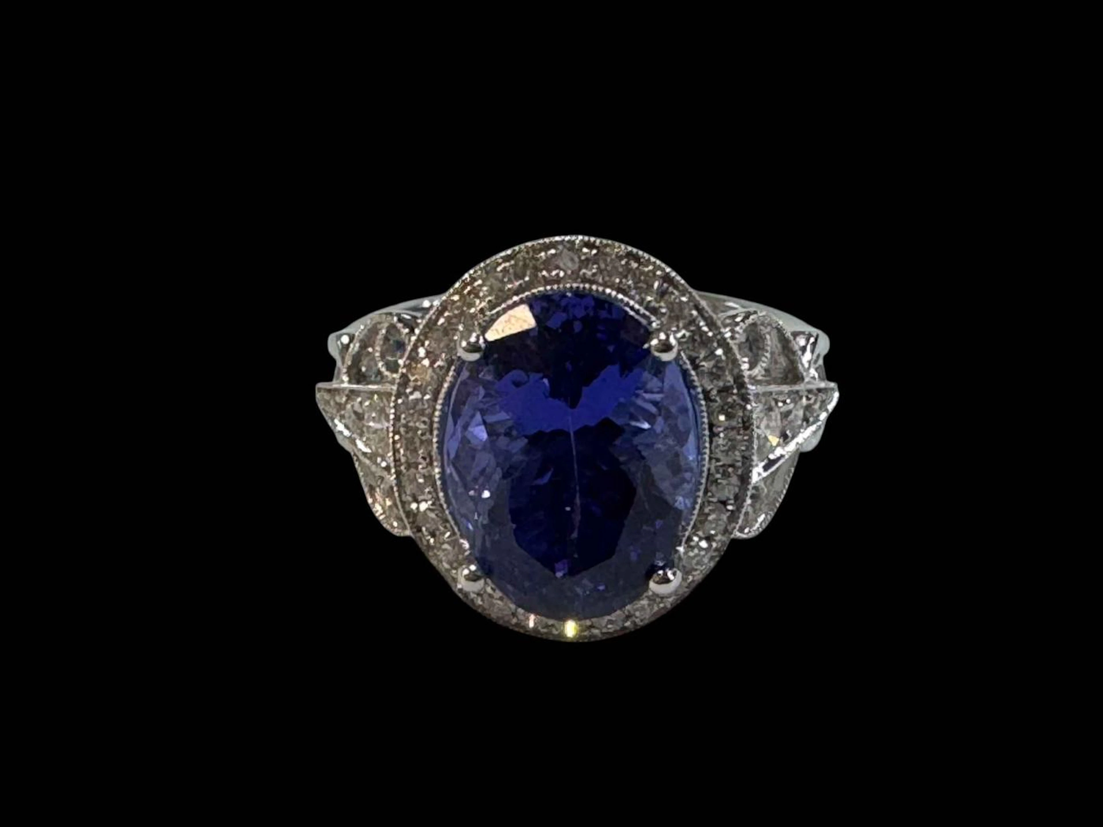18 carat white gold diamond and tanzanite ring, set with oval tanzanite