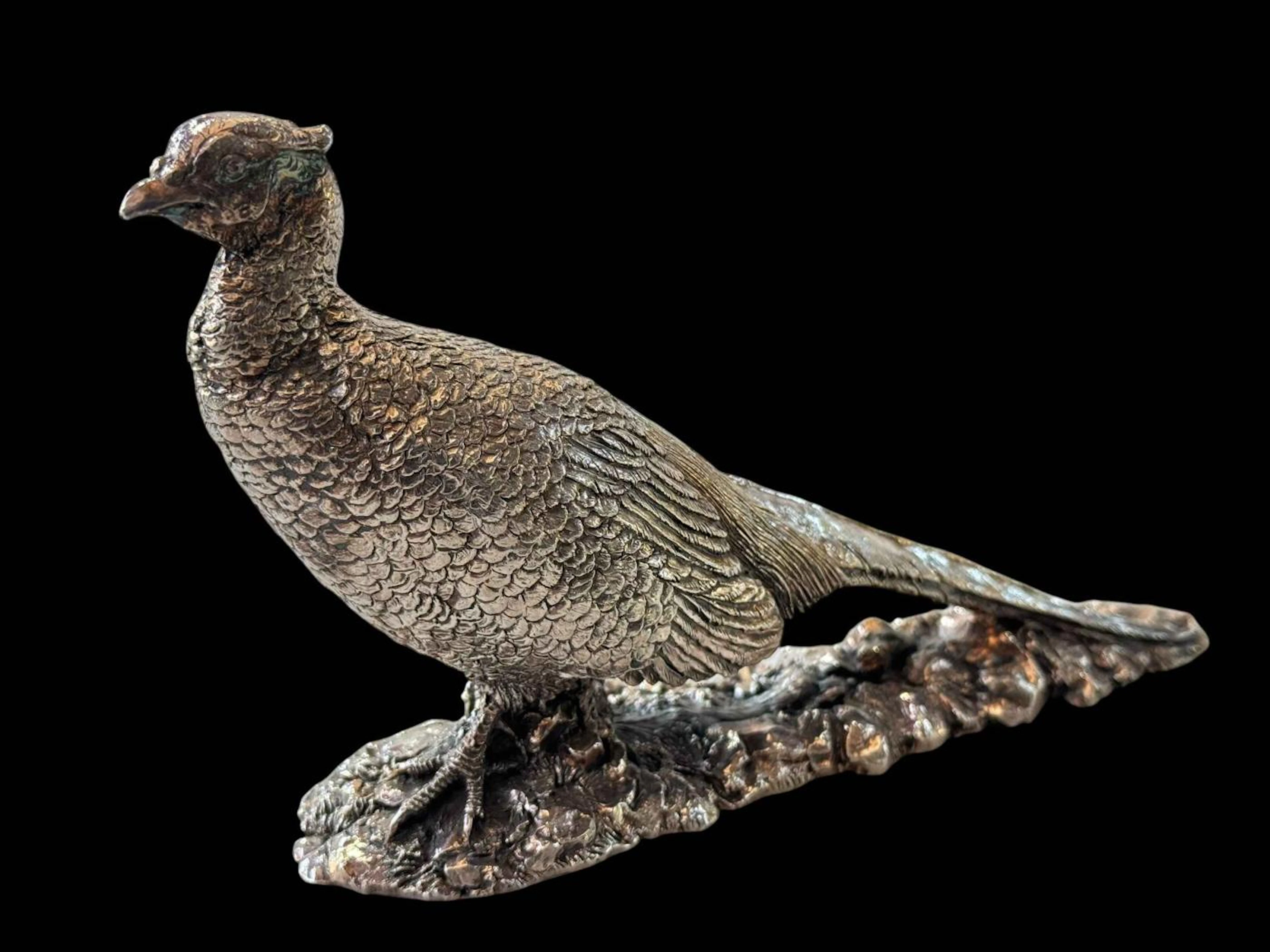 Silver loaded model of a pheasant, 20cm length.