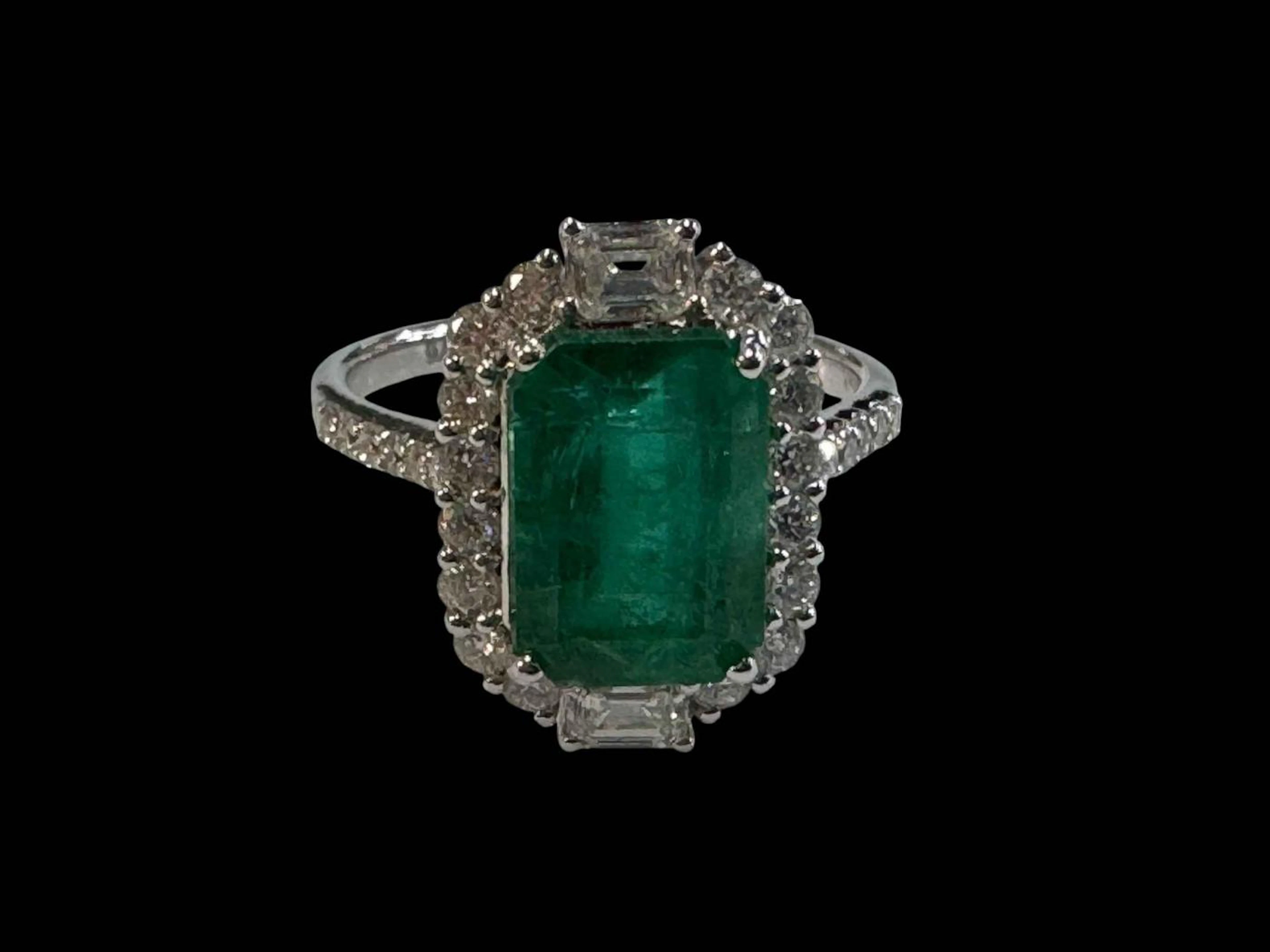 Emerald and diamond cluster ring, the rectangular emerald 3.59 carats