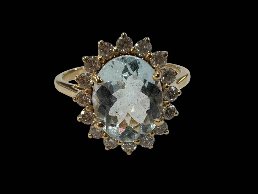 18 carat yellow gold aquamarine and diamond cluster ring, size O.