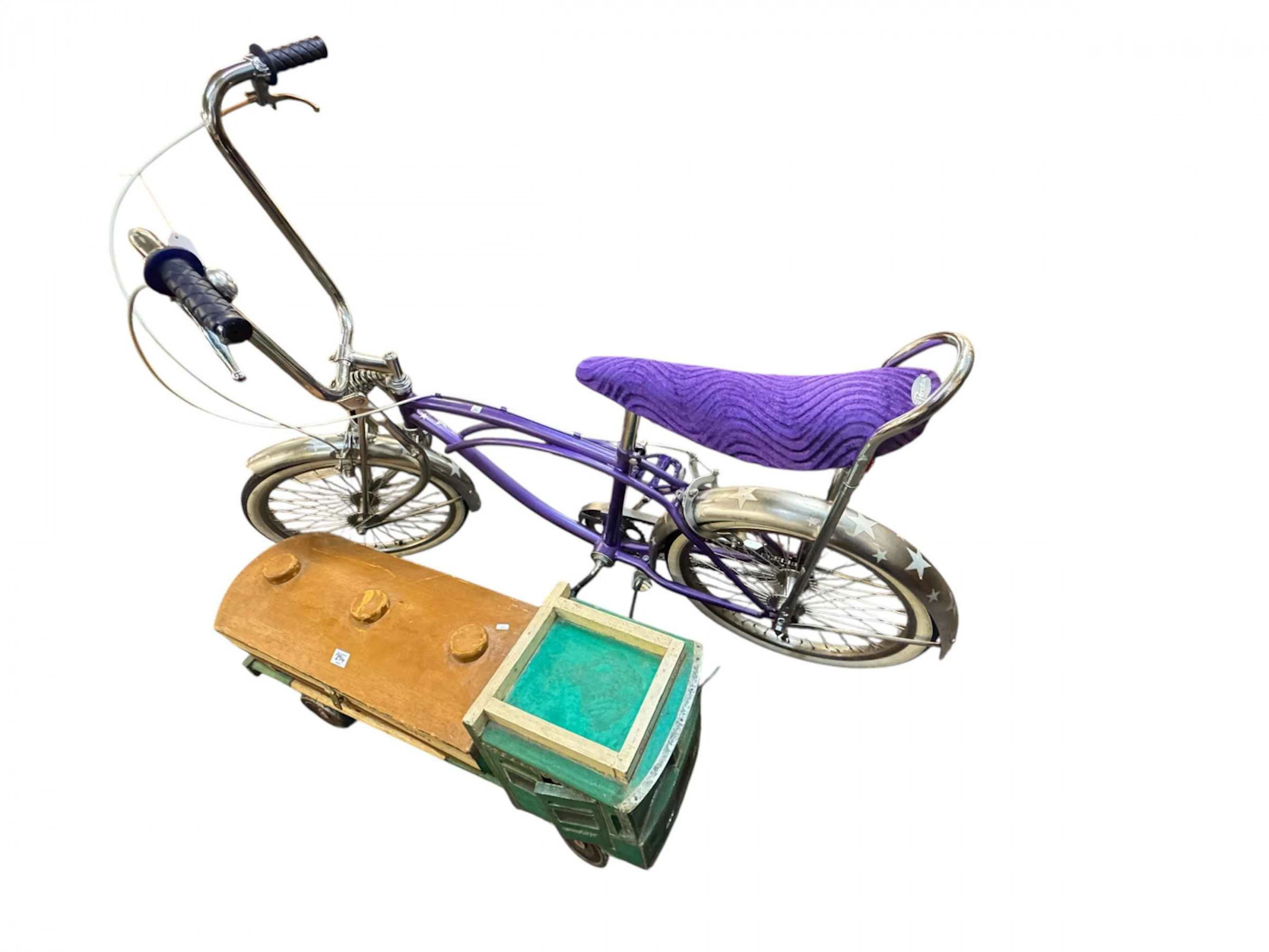 Vintage Bratz Low Rider cycle and wooden model of an Arabian oil tanker