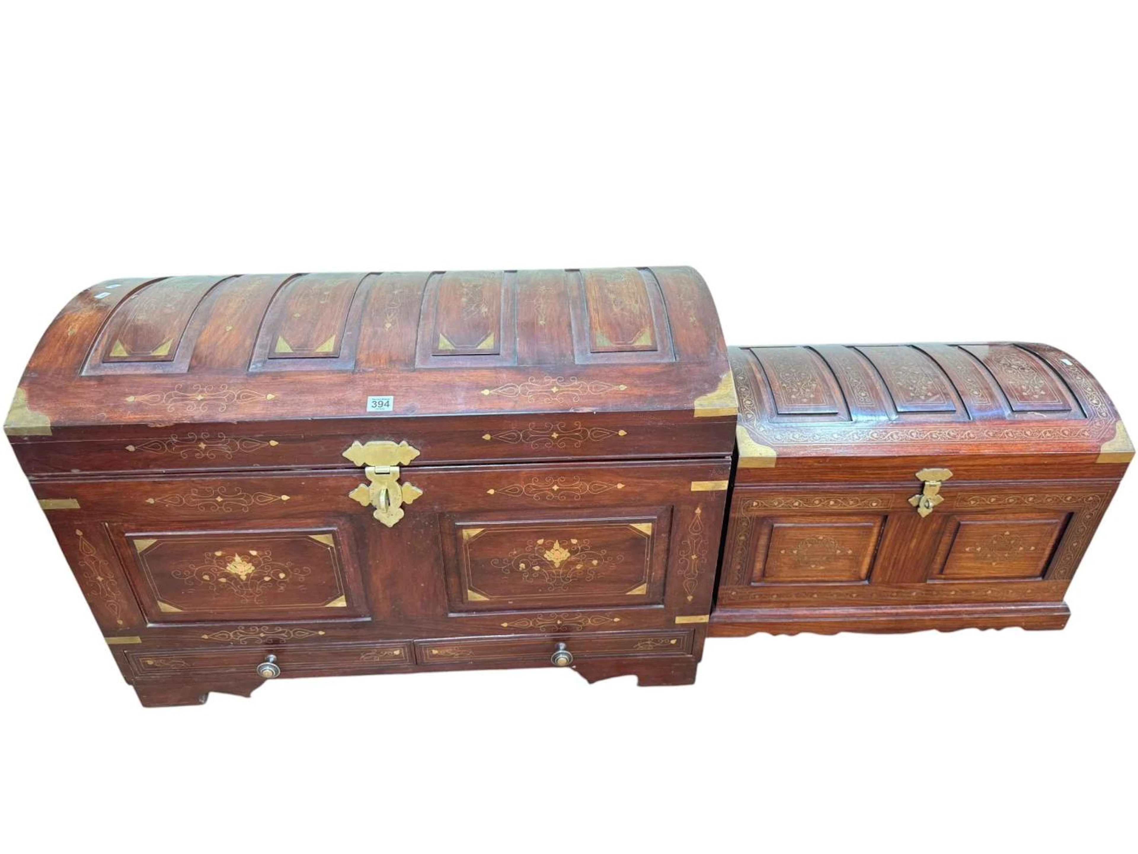 Large and small eastern brass inlaid hardwood dome topped trunks with