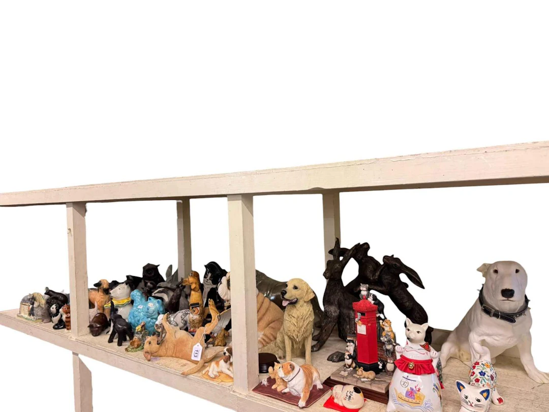 Large collection of cat, dog and other animal and bird ornaments.