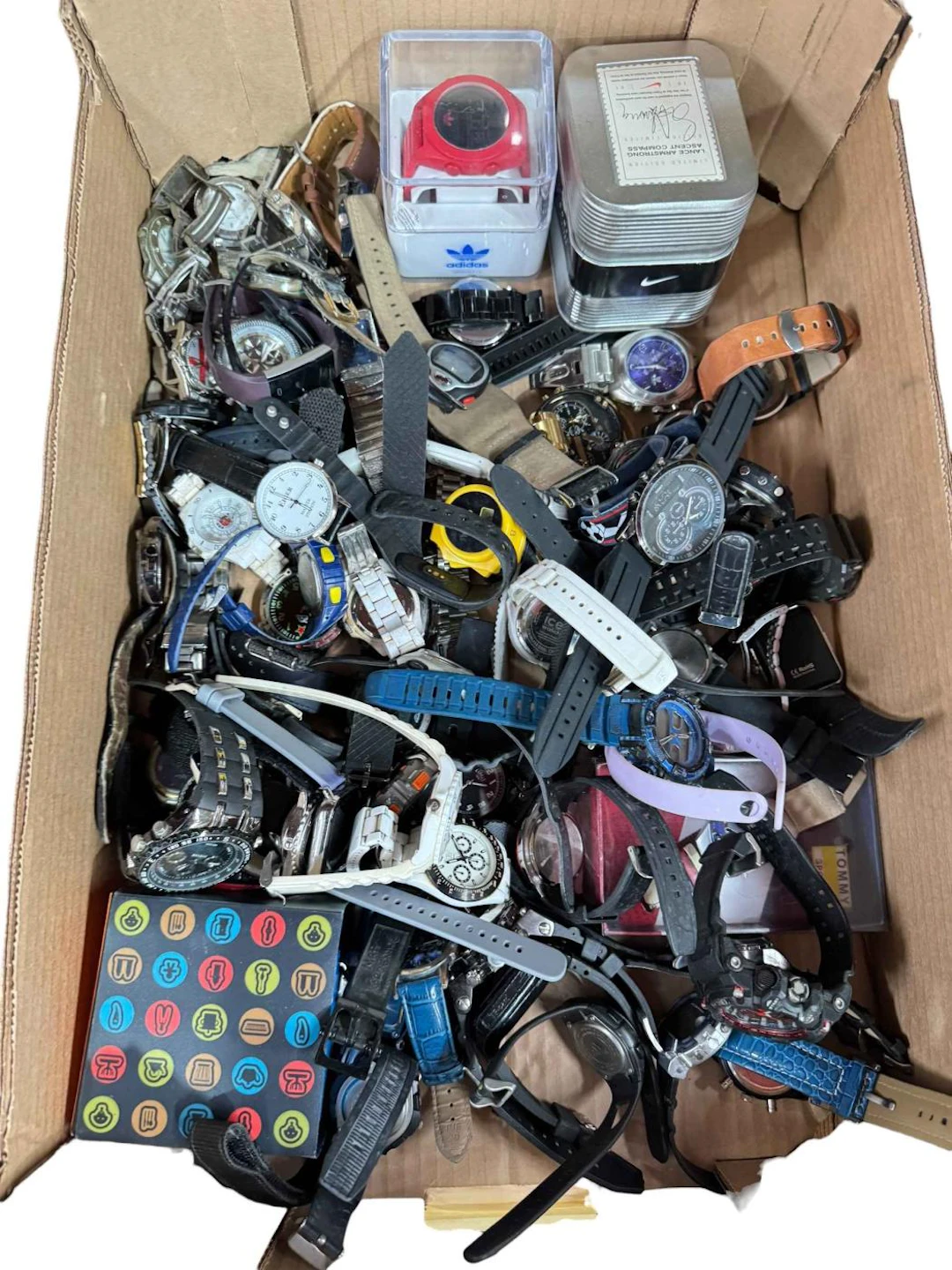 Box of mainly sports watches.