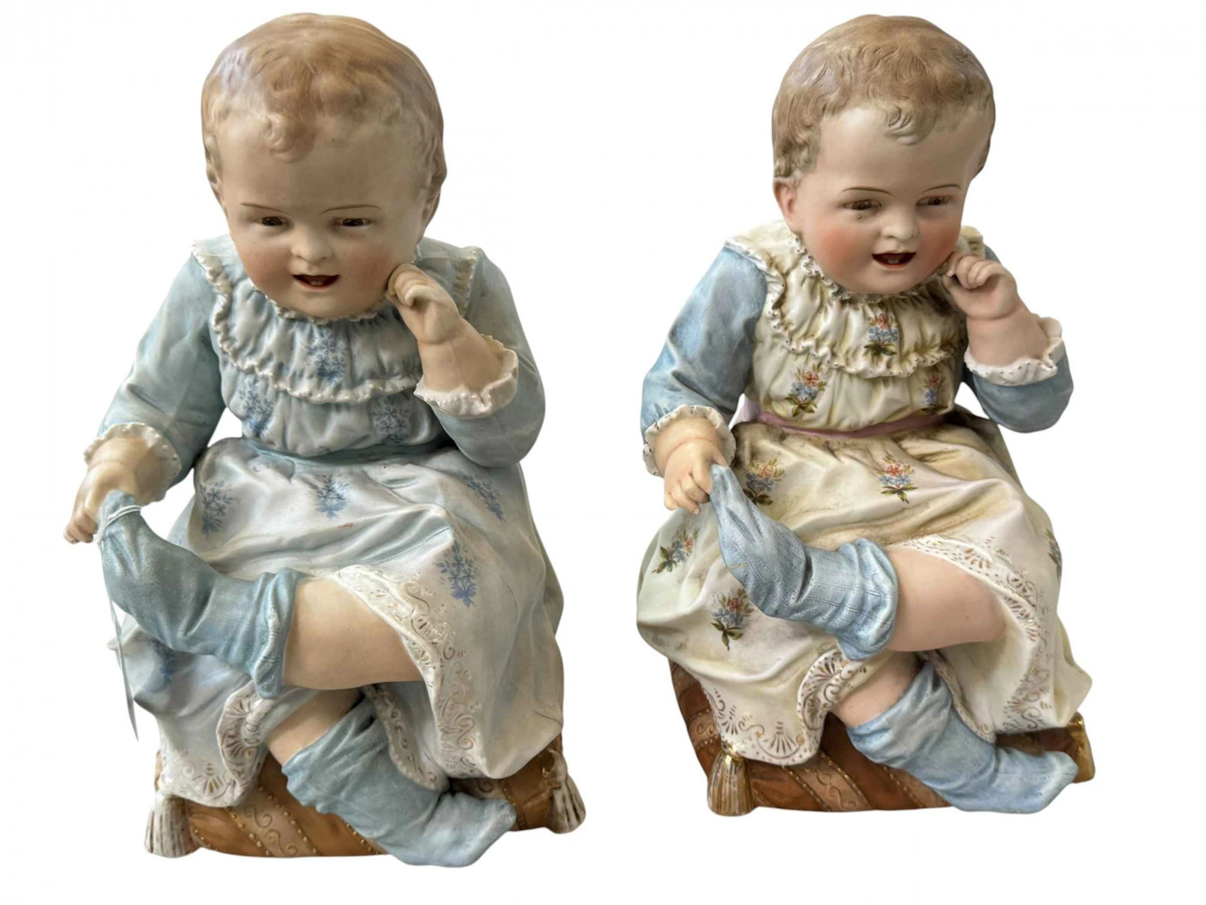 Two Victorian large bisque piano babies, 30cm.