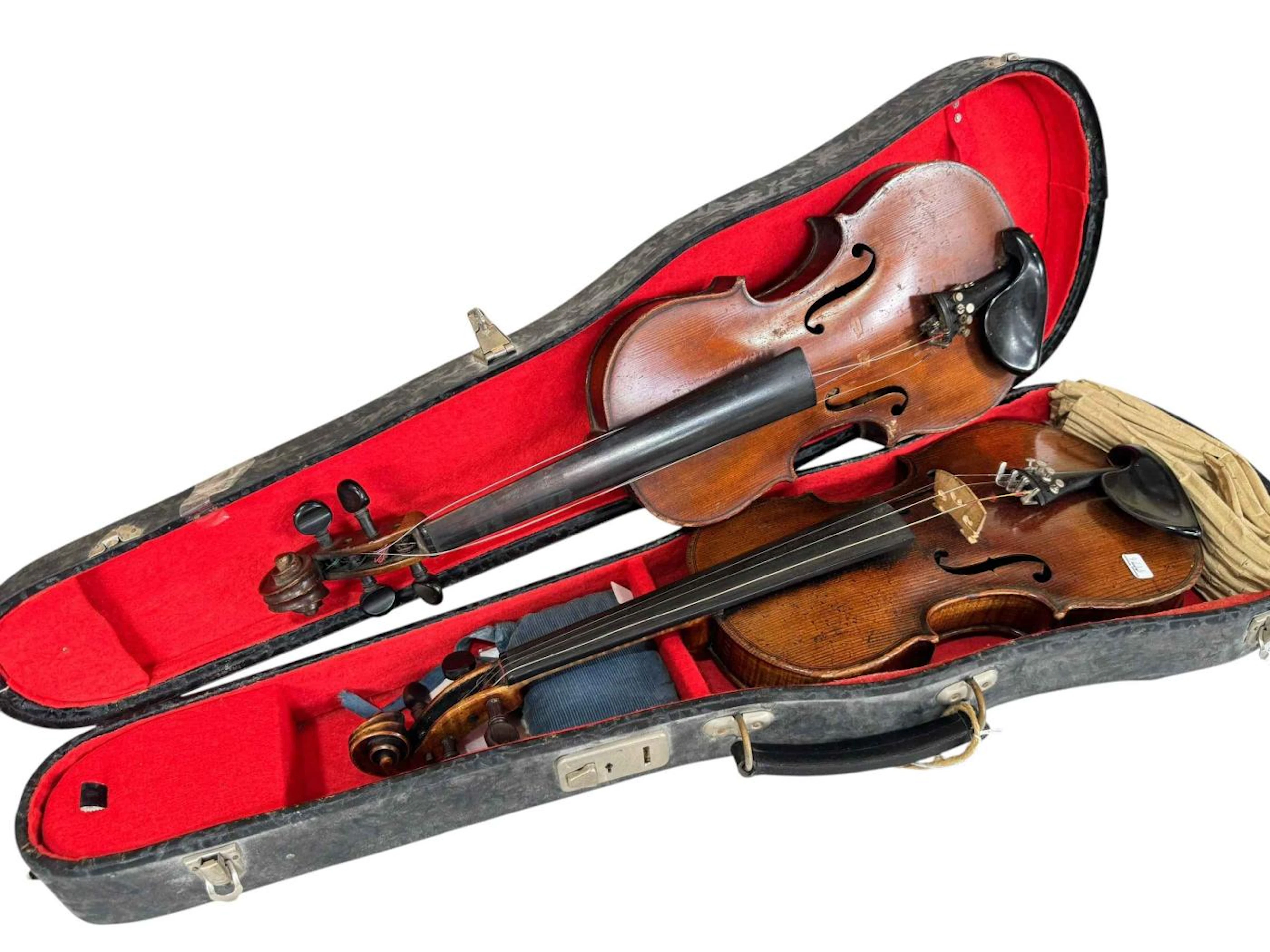 Two violins, one with London The Maidstone label, the other Stradivarius