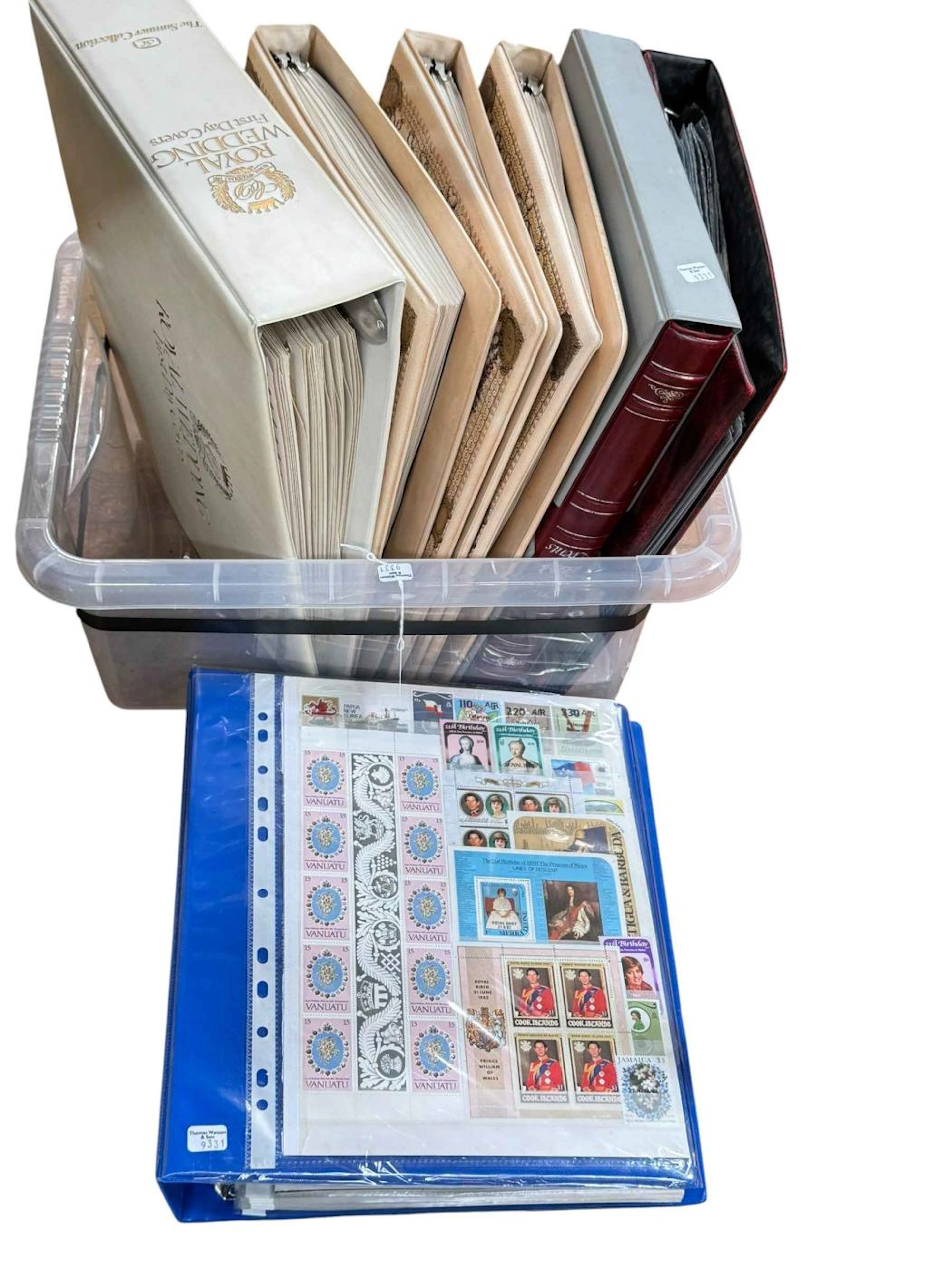 Seven royalty and other stamp albums.