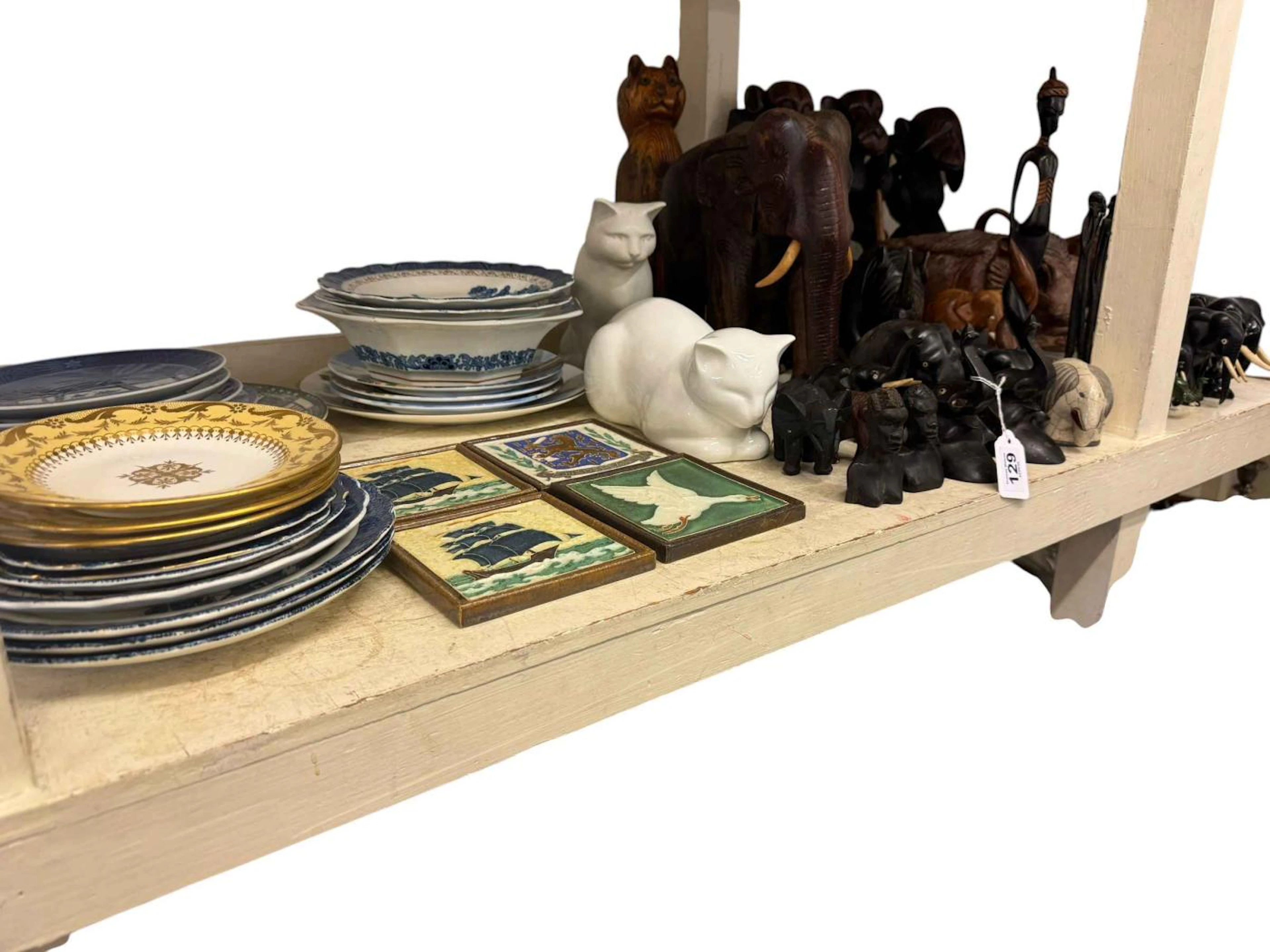 Collection of wooden tribal and animal figures together with four