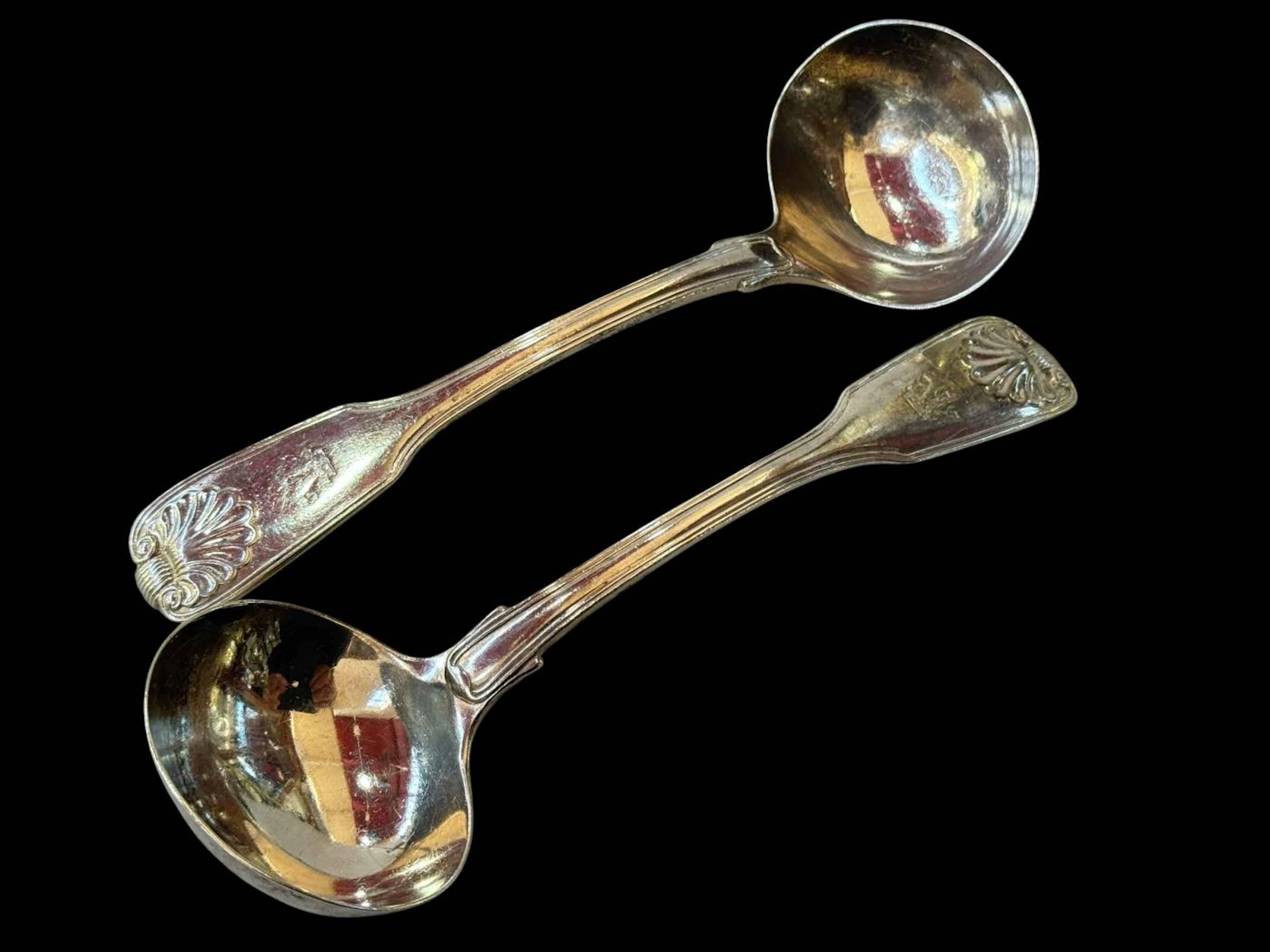 Pair of William Chawner silver fiddle and shell pattern sauce ladles
