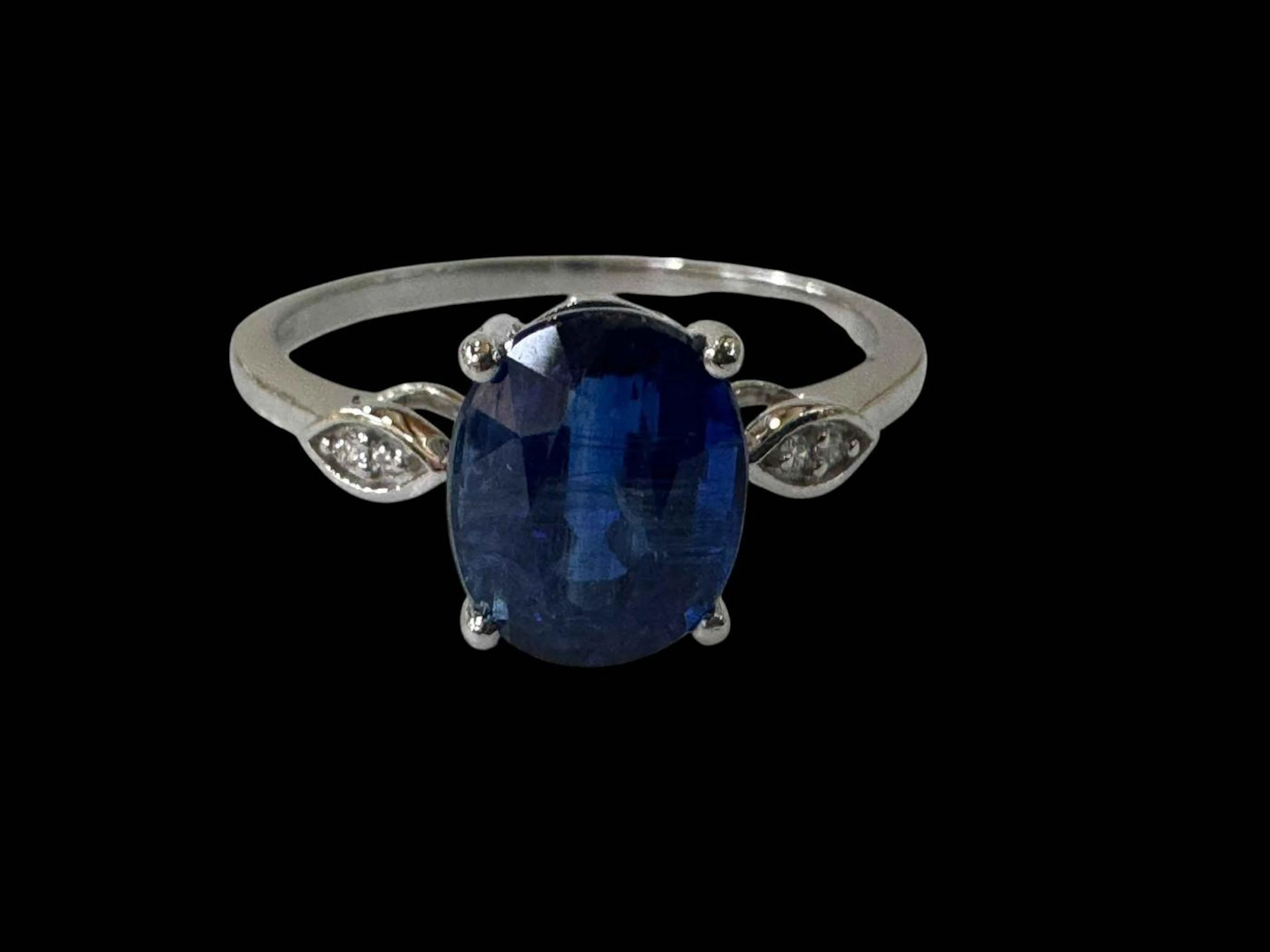 Nilamani and diamond platinum set ring, size P/Q.