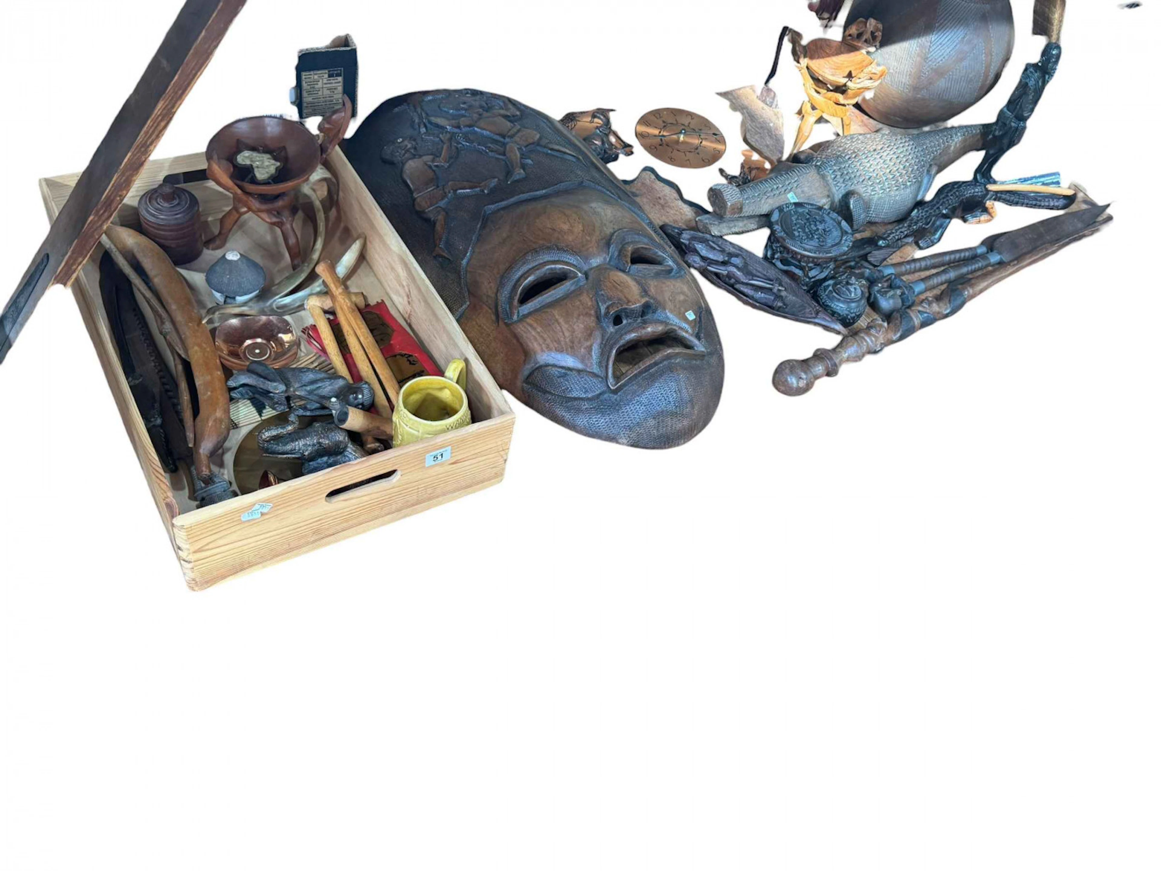 Collection of tribal arts including a large face mask, figures, crocodiles