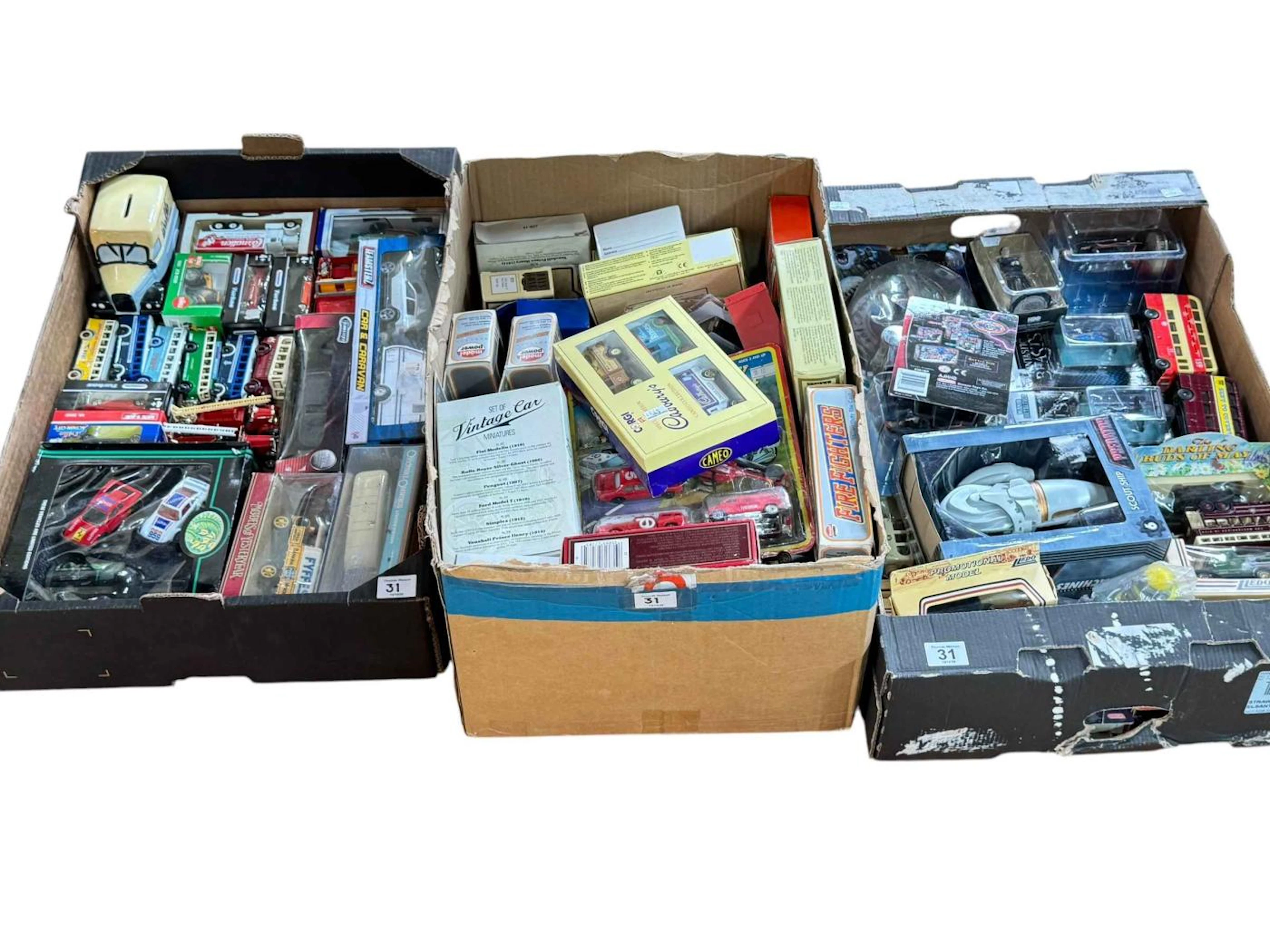 Three boxes of diecast and other model vehicles.