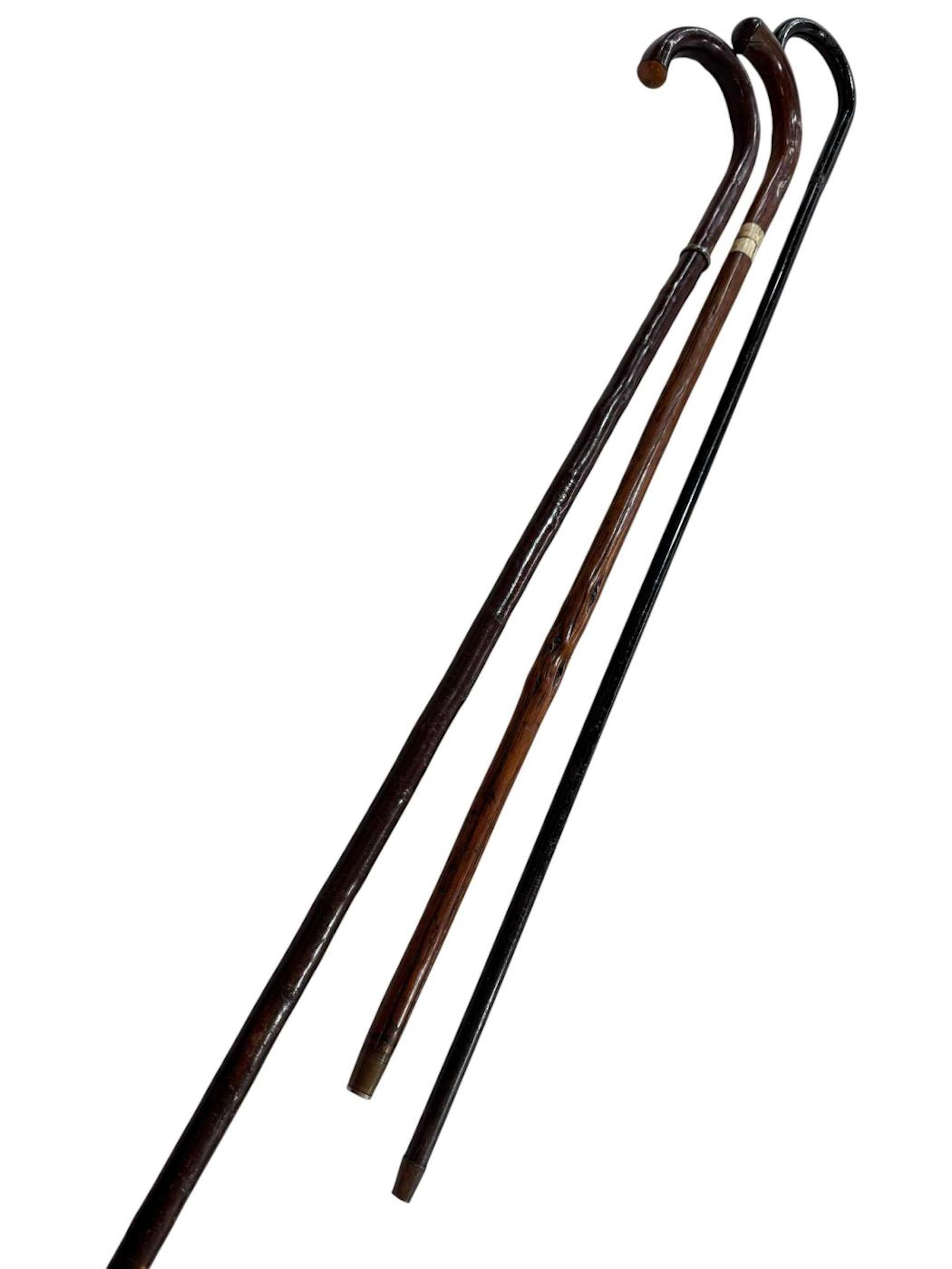Three sword sticks including Indian metal 1920's stick.