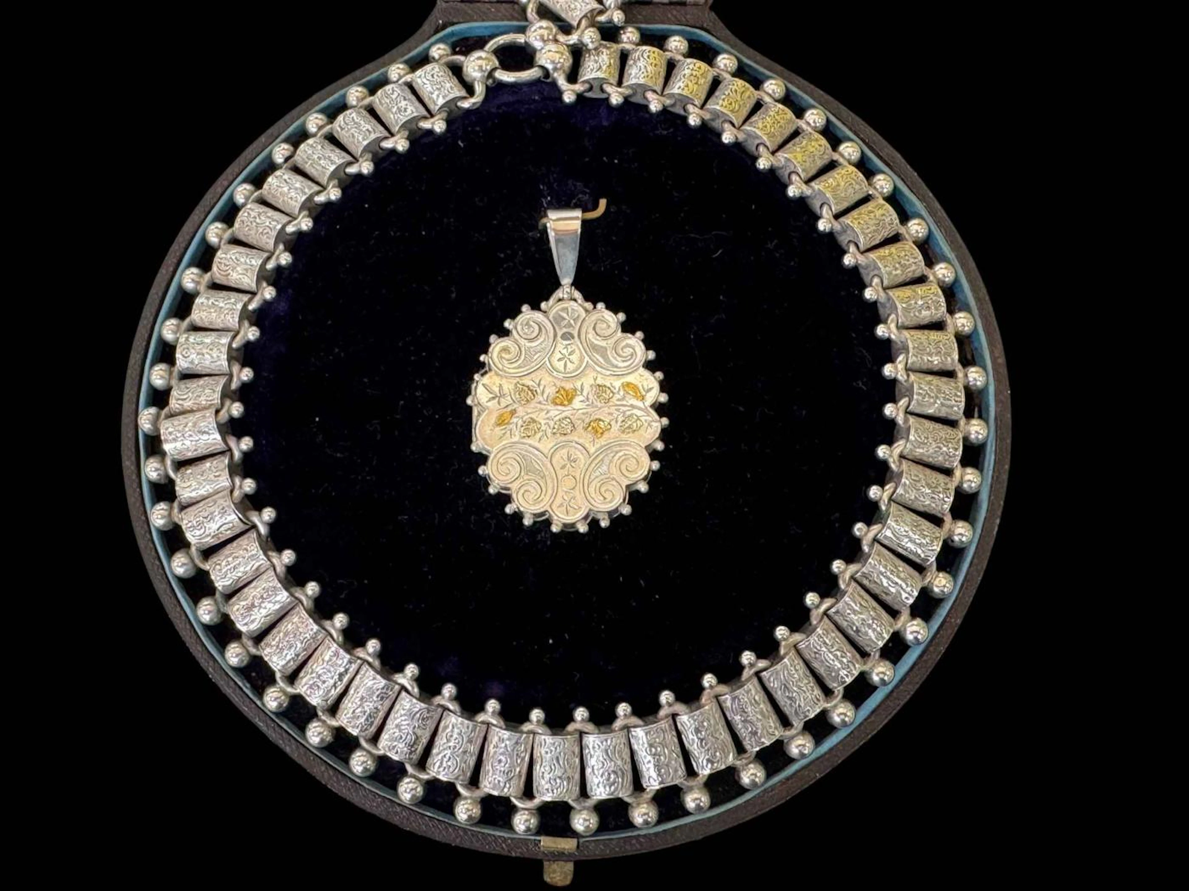 Victorian silver choker necklace with engraved links, and pendant
