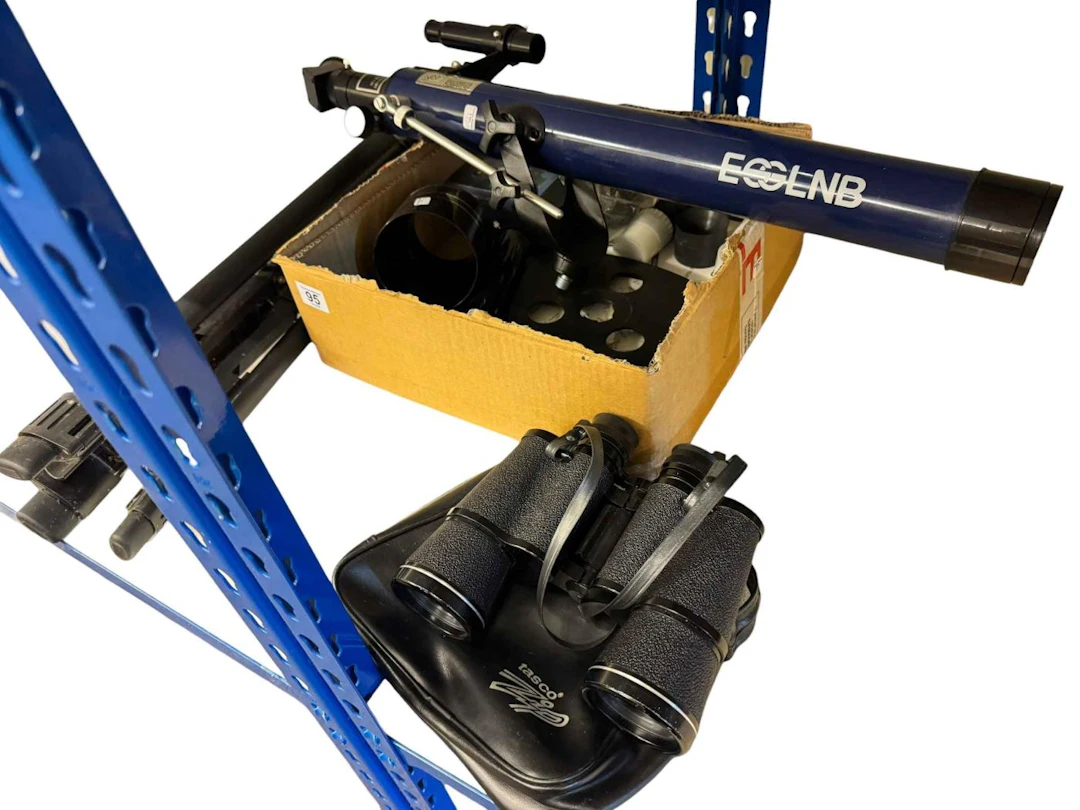 An ESSLNB blue refractor telescope with tripod and accessories, and